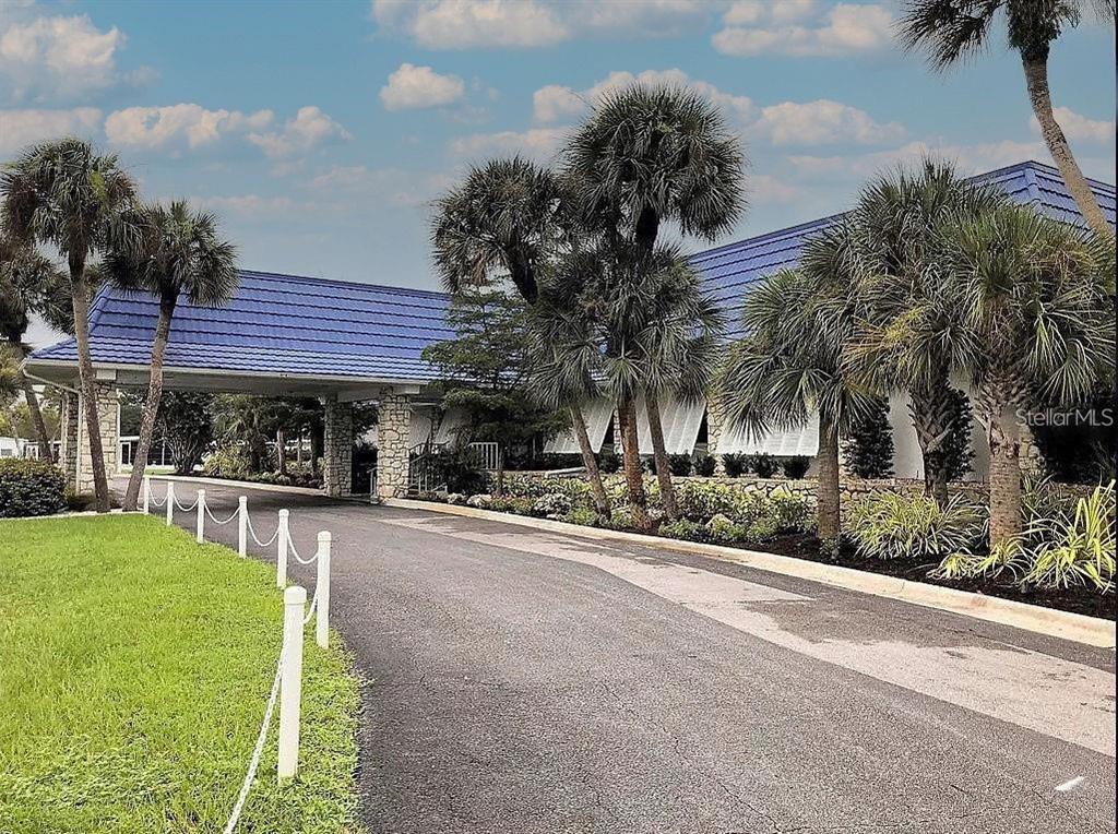 706 Roma Road Venice, FL 34285 - Photo 11 of 24 a view of a house with a yard and sitting area