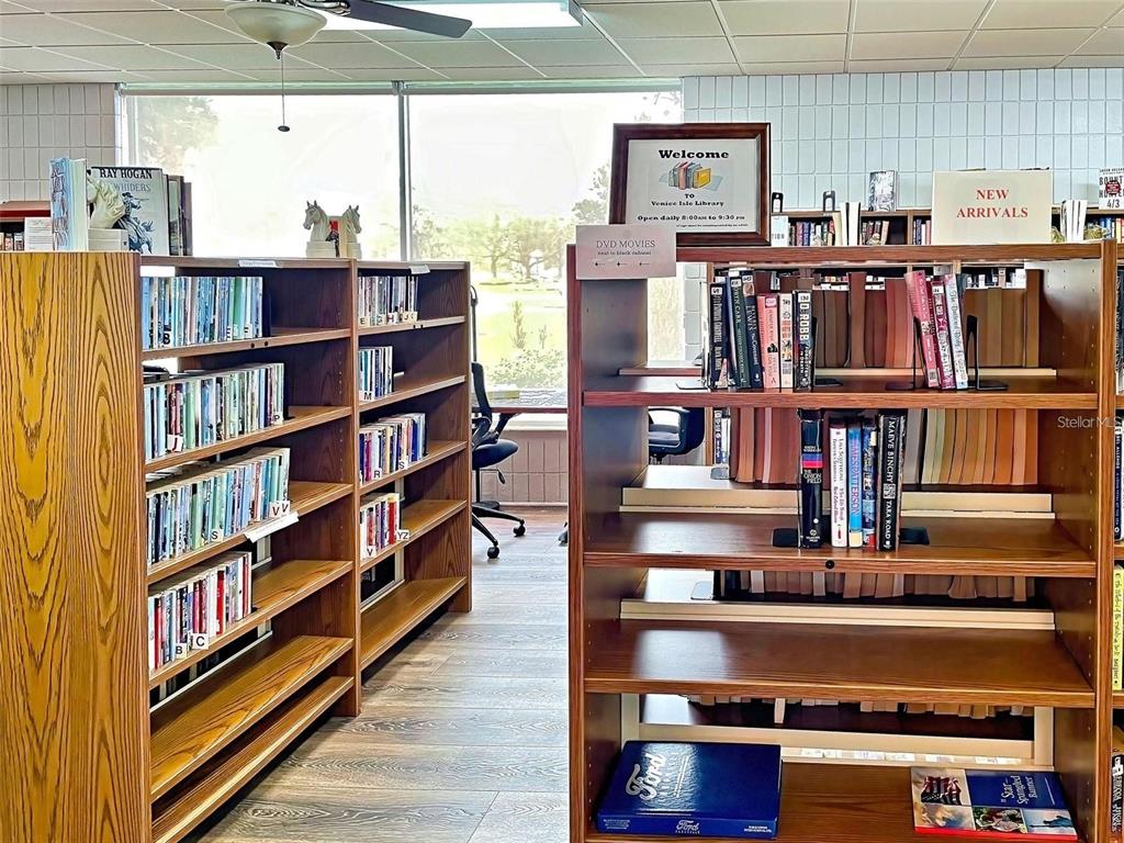 706 Roma Road Venice, FL 34285 - Photo 13 of 24 a view of cabinet with a open kitchen