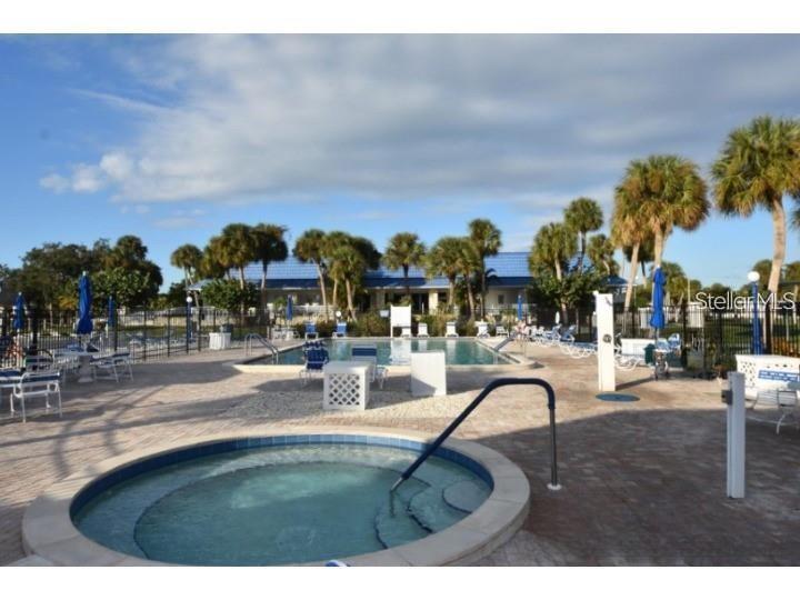 706 Roma Road Venice, FL 34285 - Photo 17 of 24 a view of a swimming pool with outdoor seating