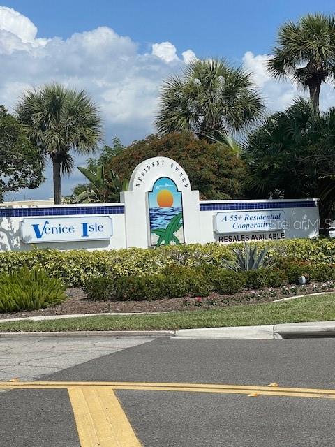 706 Roma Road Venice, FL 34285 - Photo 2 of 24 a view of a street with a building in the background