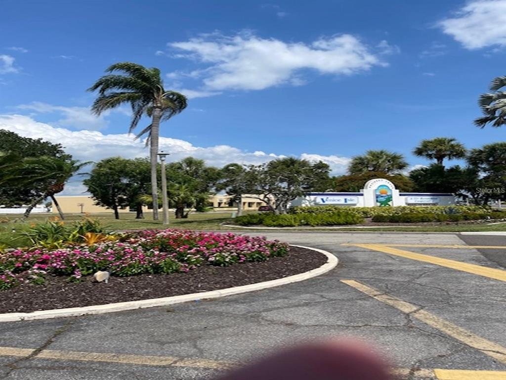 706 Roma Road Venice, FL 34285 - Photo 5 of 24 a view of a garden with flowers and plants