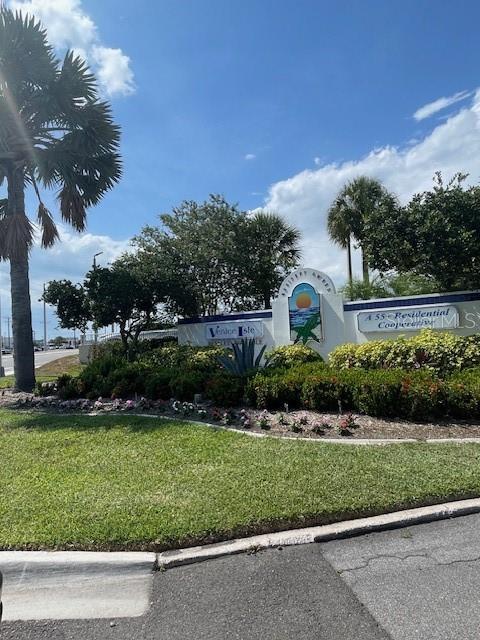 706 Roma Road Venice, FL 34285 - Photo 6 of 24 a front view of a house with a yard and garage