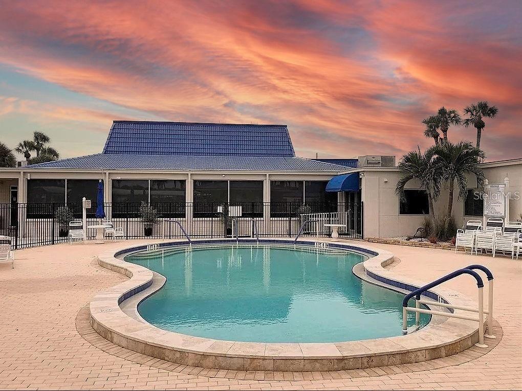 706 Roma Road Venice, FL 34285 - Photo 7 of 24 a view of a house with swimming pool and a sitting area