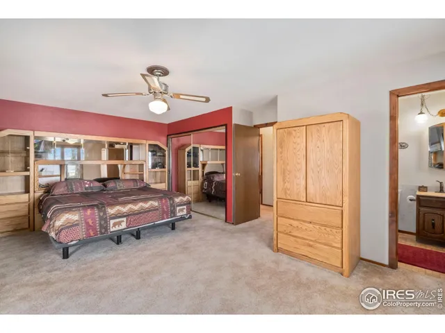 a living room with furniture a window and a flat screen tv