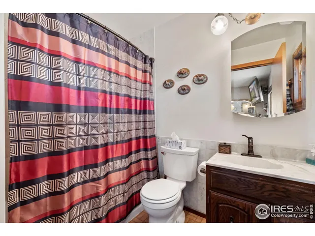 a view of a storage room with a table and chairs