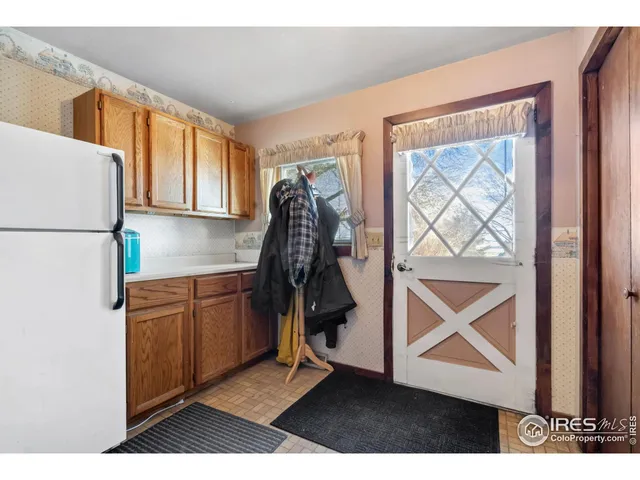 a view of a livingroom with furniture and windows