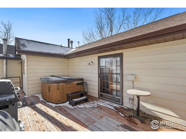 a view of a house with a yard covered in snow