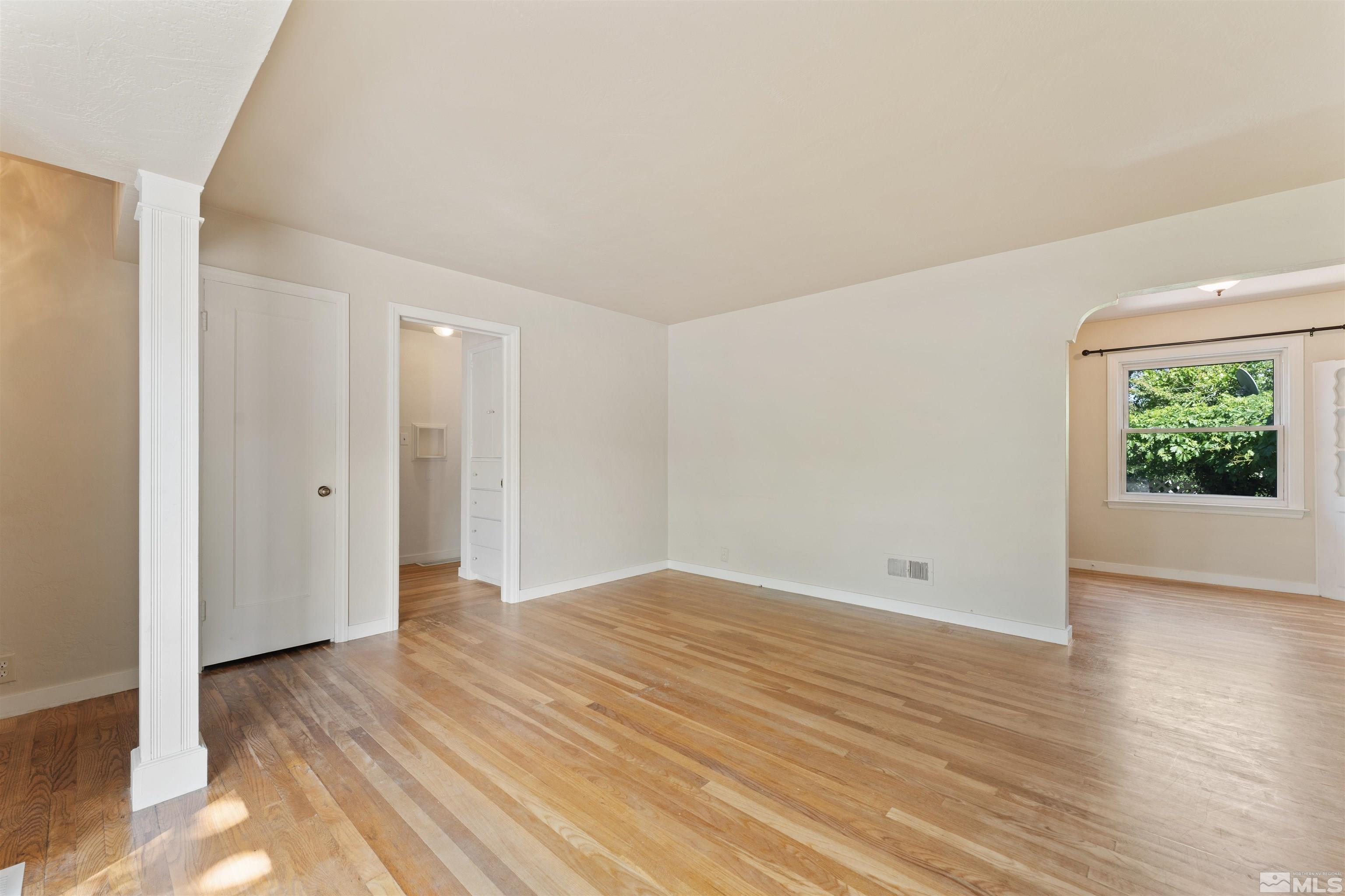 1624 Watt Street Reno, NV 89509 - Photo 11 of 40 a view of an empty room with wooden floor and window