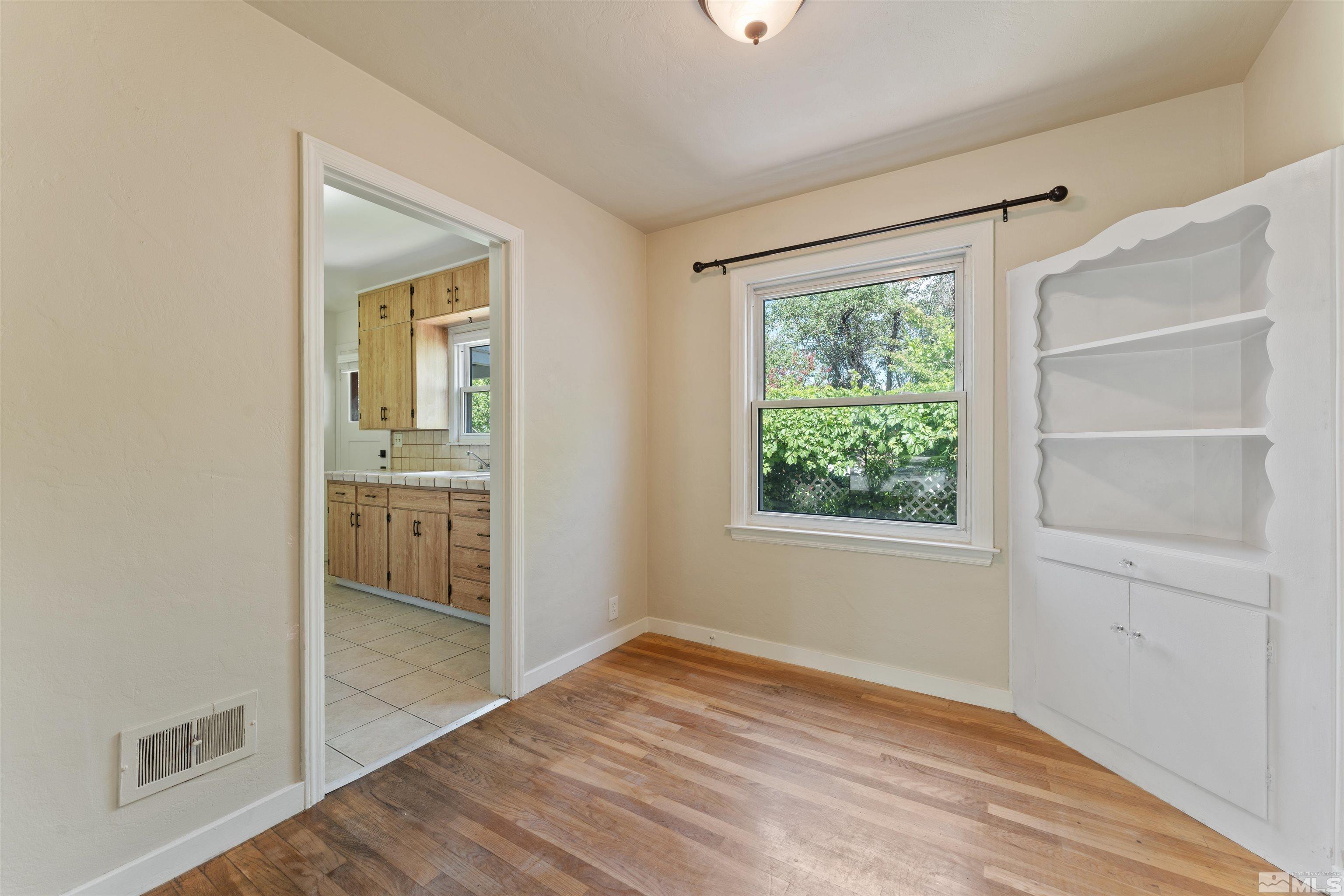 1624 Watt Street Reno, NV 89509 - Photo 12 of 40 a view of empty room with wooden floor and fan