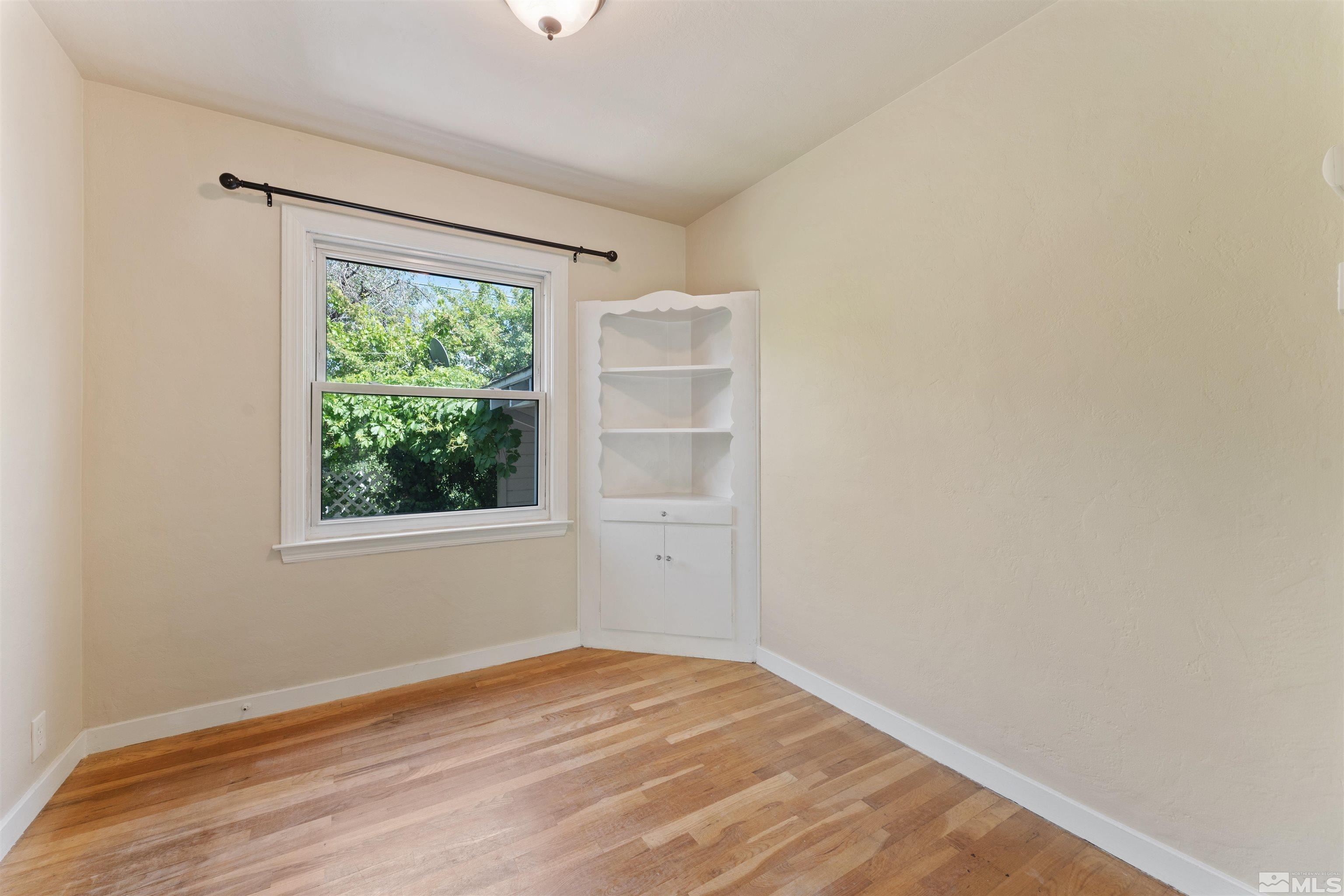 1624 Watt Street Reno, NV 89509 - Photo 13 of 40 a view of empty room with wooden floor and fan