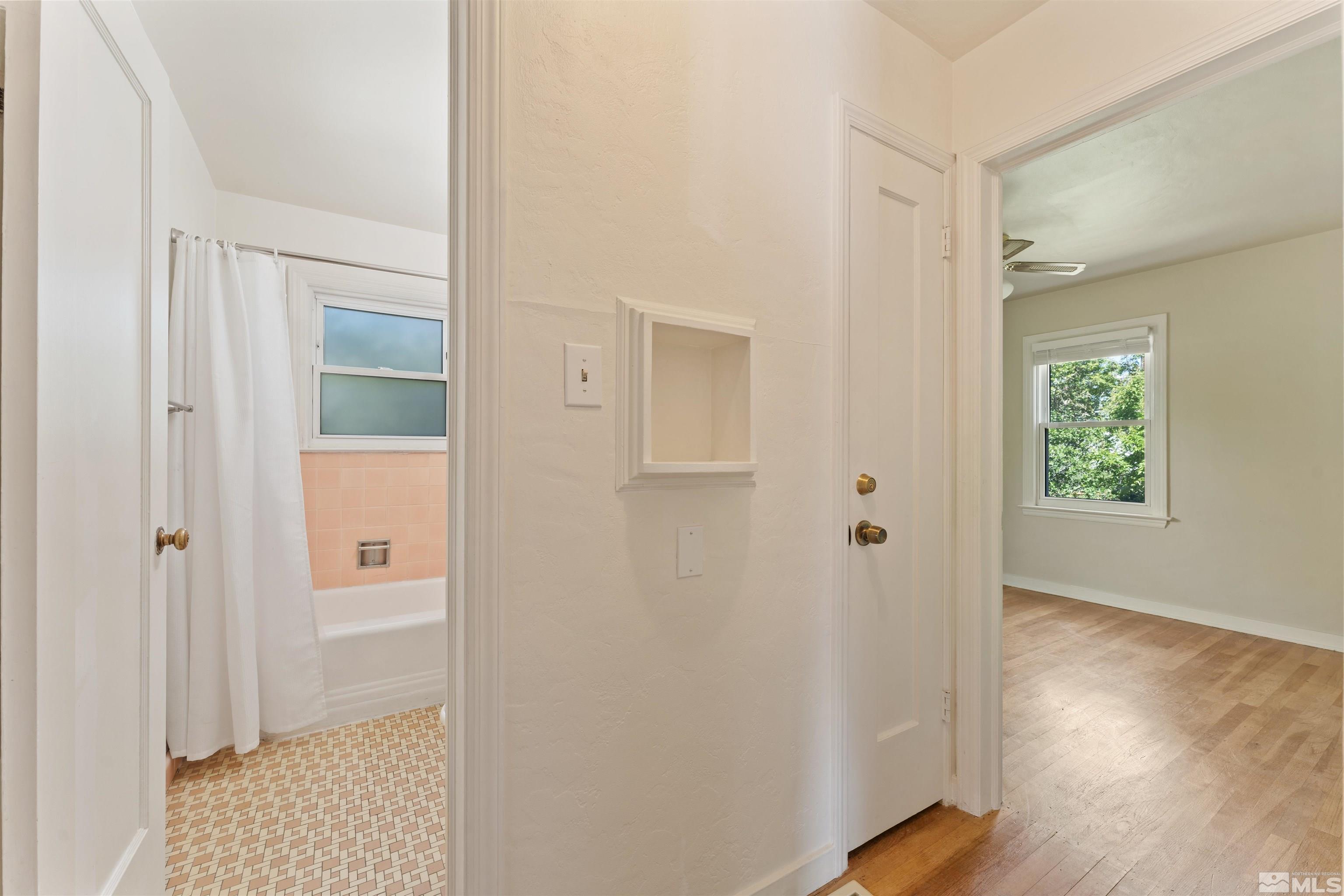 1624 Watt Street Reno, NV 89509 - Photo 14 of 40 a view of a hallway with wooden floor and a bathroom
