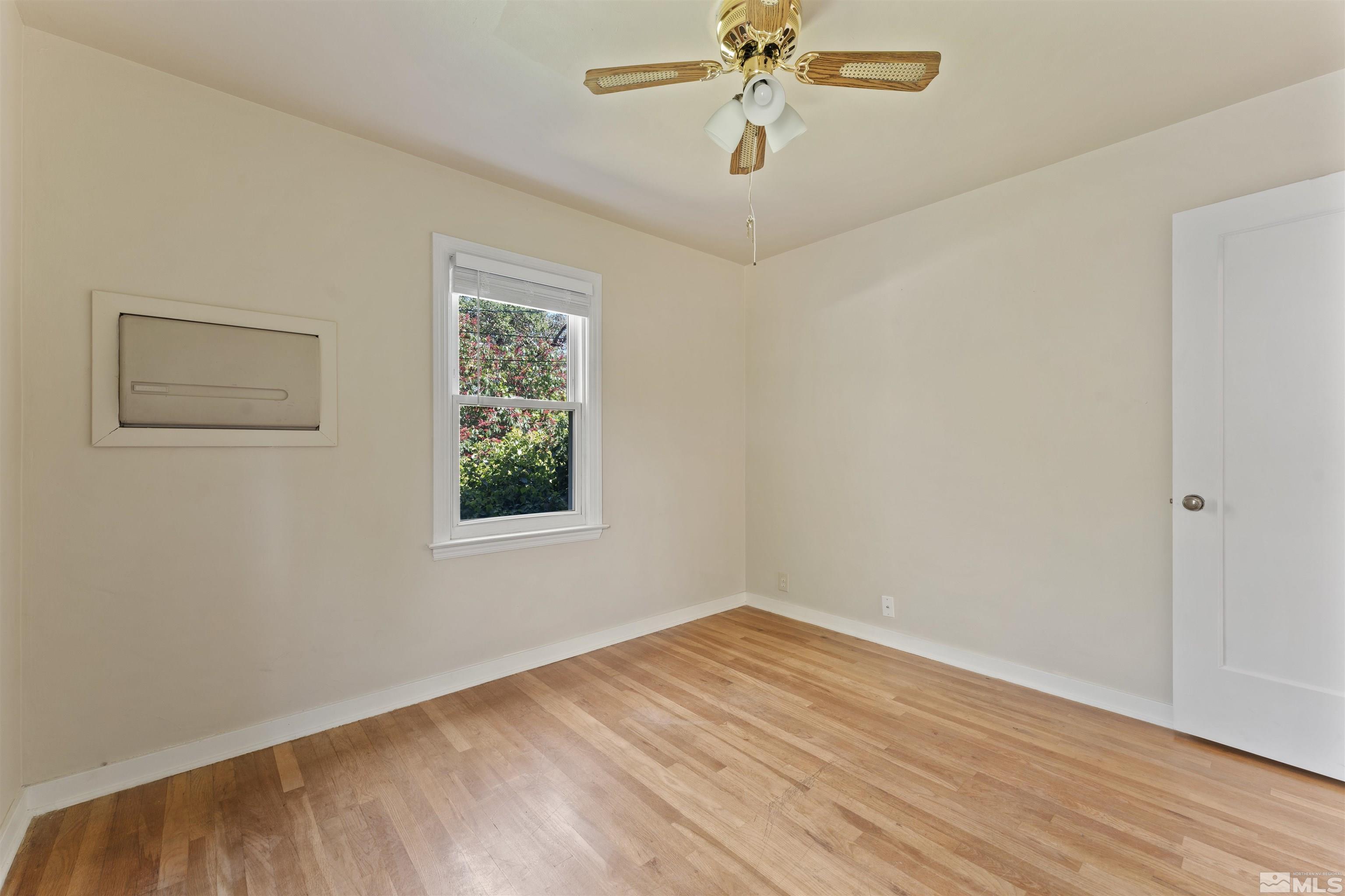 1624 Watt Street Reno, NV 89509 - Photo 18 of 40 a view of empty room with wooden floor and fan