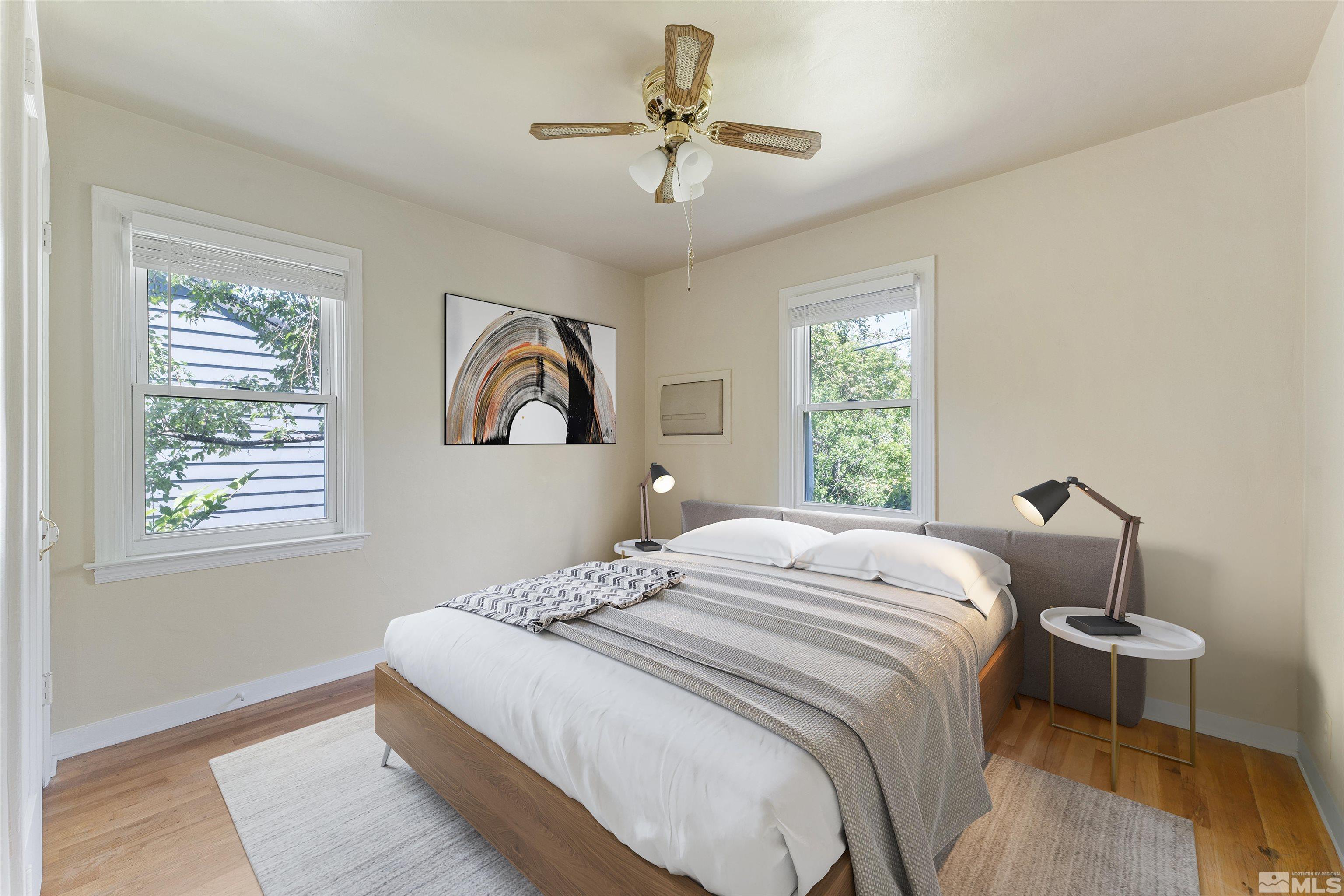 1624 Watt Street Reno, NV 89509 - Photo 19 of 40 a bedroom with a bed and a chandelier
