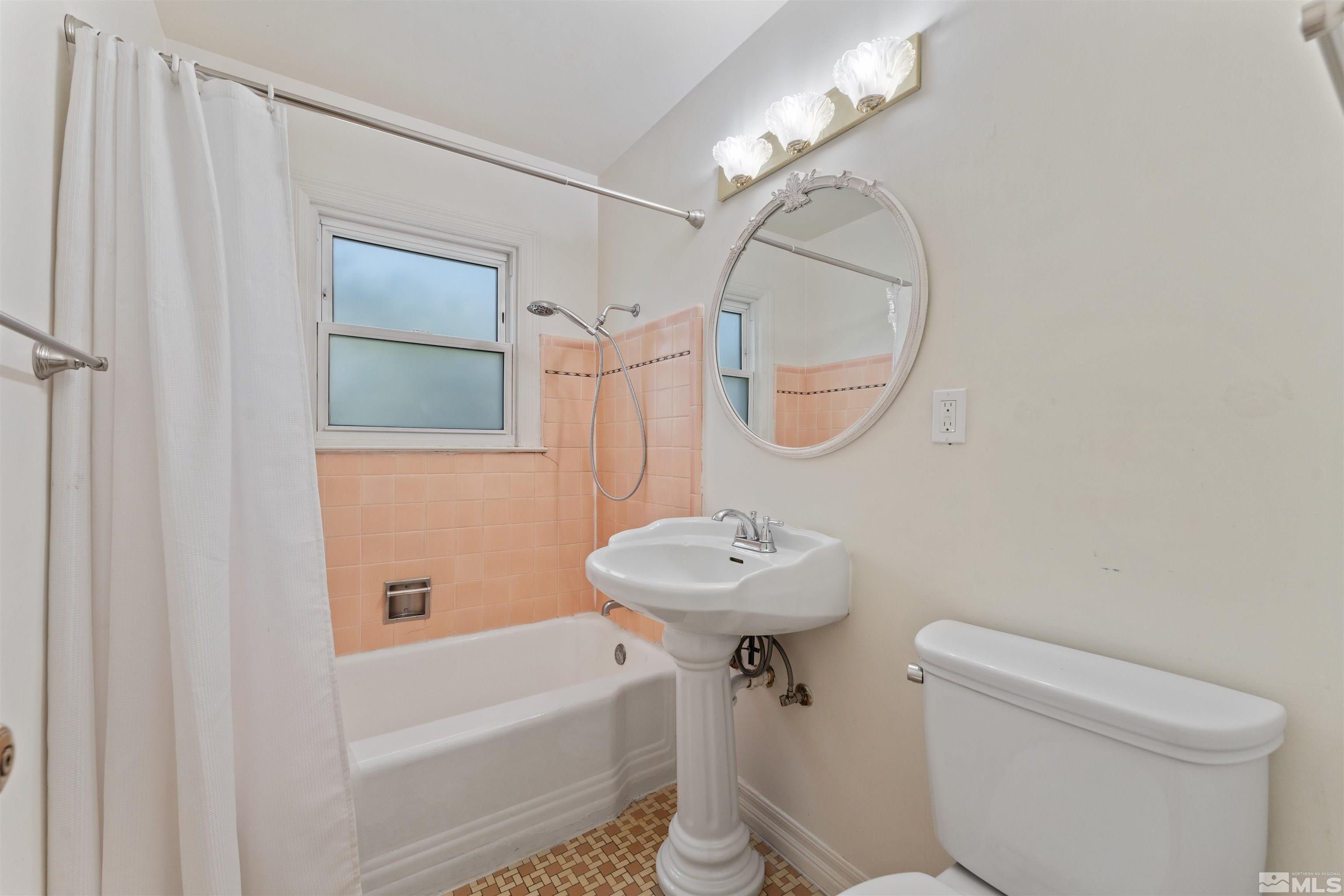 1624 Watt Street Reno, NV 89509 - Photo 21 of 40 a bathroom with a sink a mirror toilet and bathtub