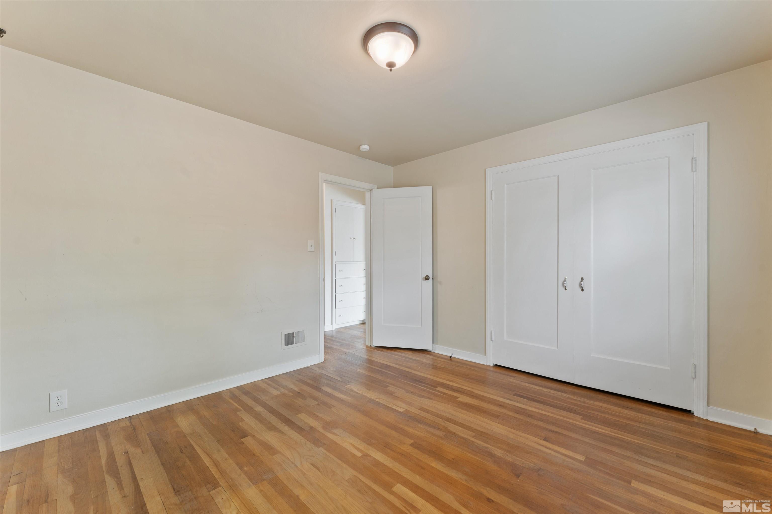 1624 Watt Street Reno, NV 89509 - Photo 25 of 40 a view of room with wooden floor and fan