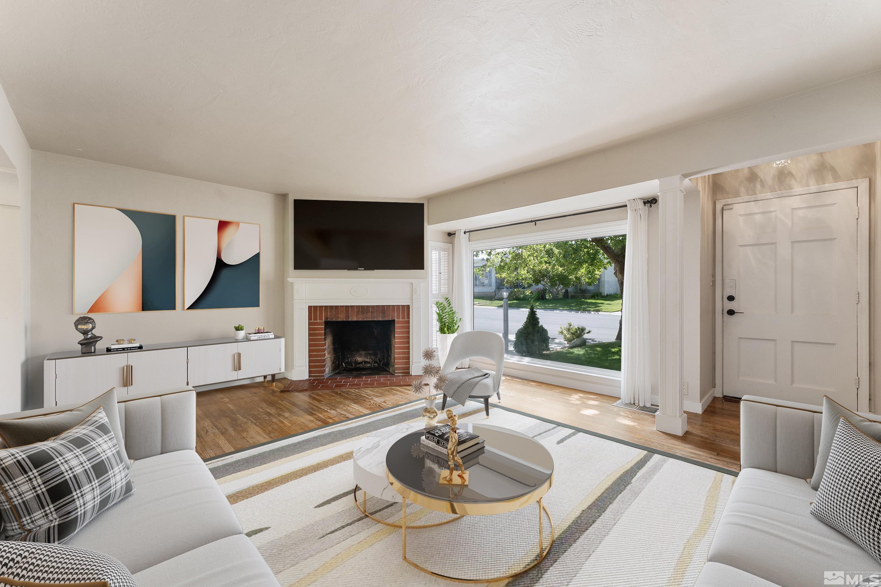 1624 Watt Street Reno, NV 89509 - Photo 5 of 40 a living room with furniture a fireplace and a flat screen tv