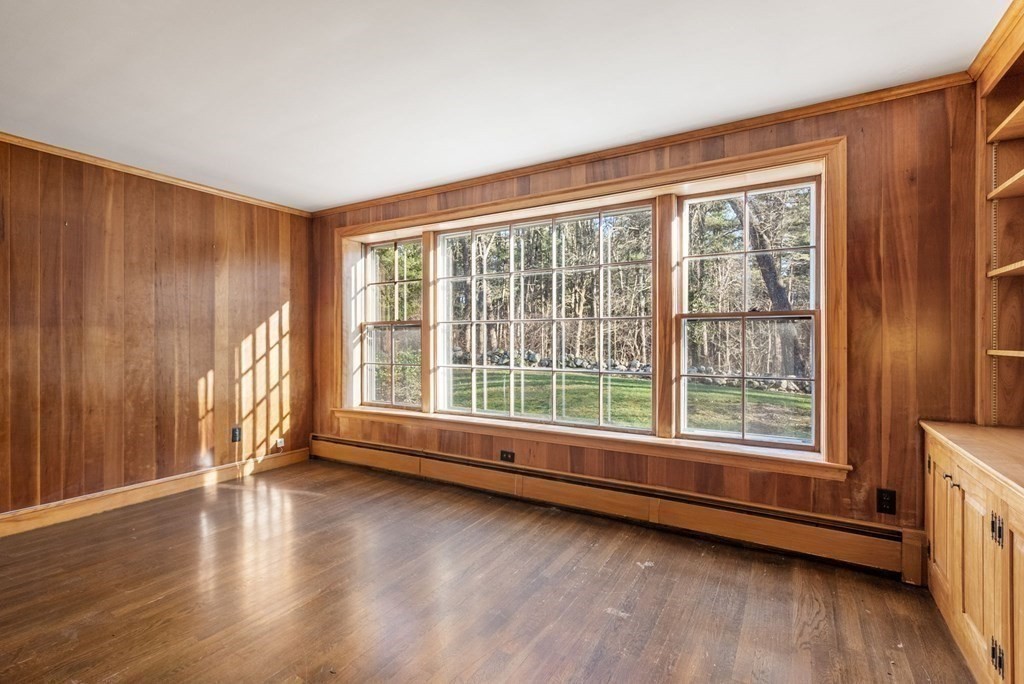 140 Cherry Brook Road Weston, MA 02493 - Photo 14 of 32 a view of an empty room with wooden floor and a window