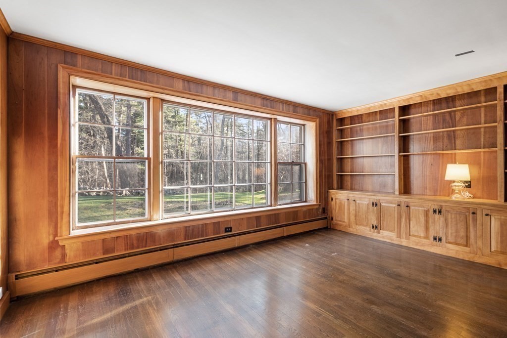 140 Cherry Brook Road Weston, MA 02493 - Photo 15 of 32 a view of an empty room with a window and wooden floor