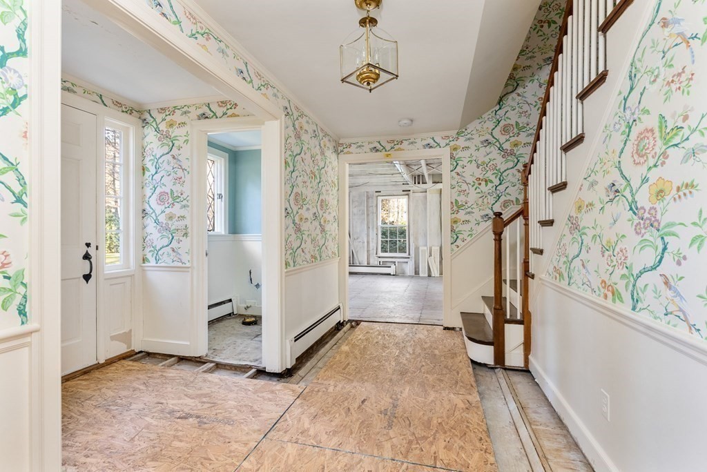 140 Cherry Brook Road Weston, MA 02493 - Photo 21 of 32 a view of a hallway with windows and chandelier
