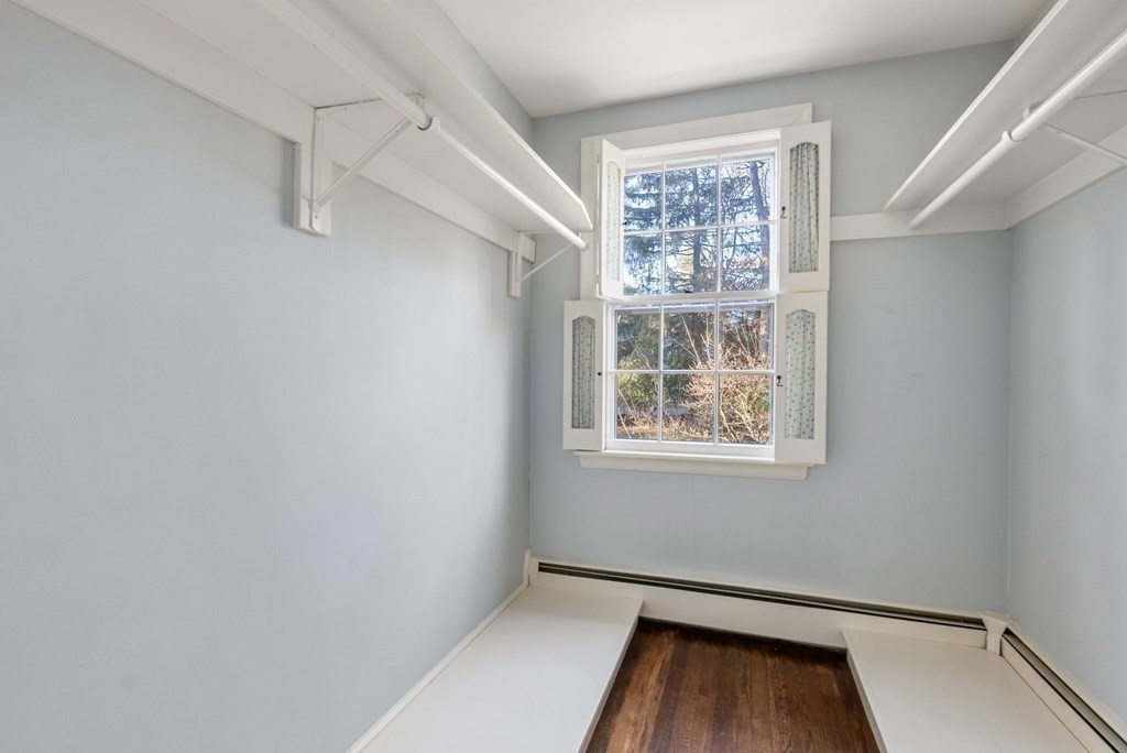 140 Cherry Brook Road Weston, MA 02493 - Photo 25 of 32 a view of an empty room with a window and wooden floor