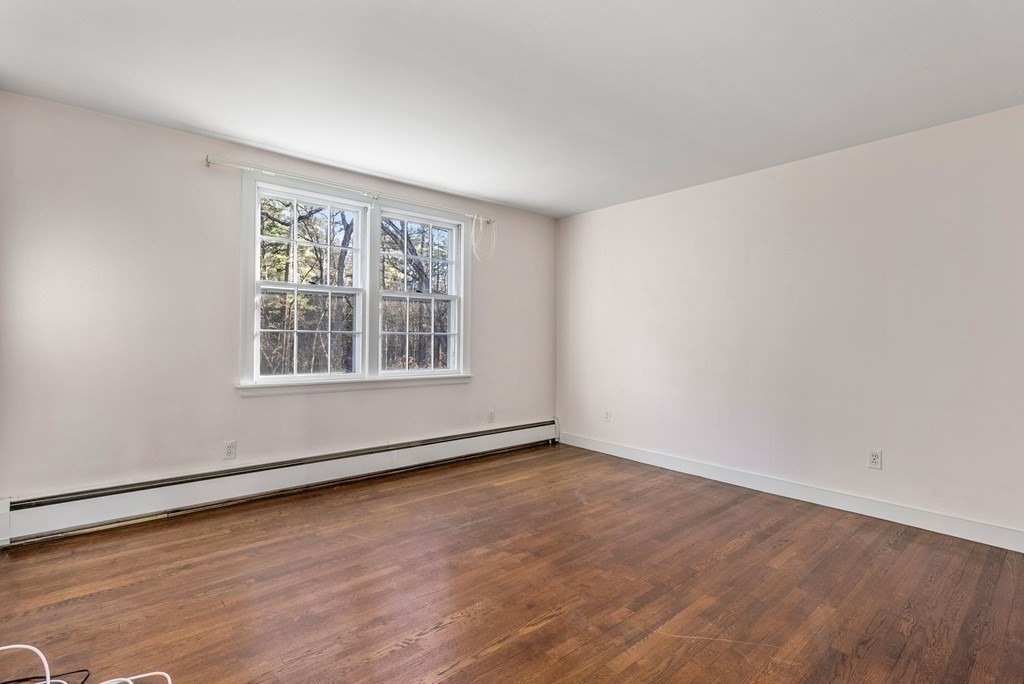 140 Cherry Brook Road Weston, MA 02493 - Photo 27 of 32 wooden floor in an empty room with a window