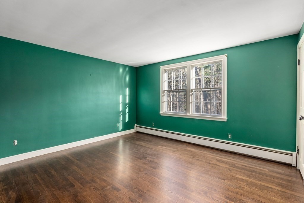 140 Cherry Brook Road Weston, MA 02493 - Photo 30 of 32 a view of an empty room with window and hardwood floor
