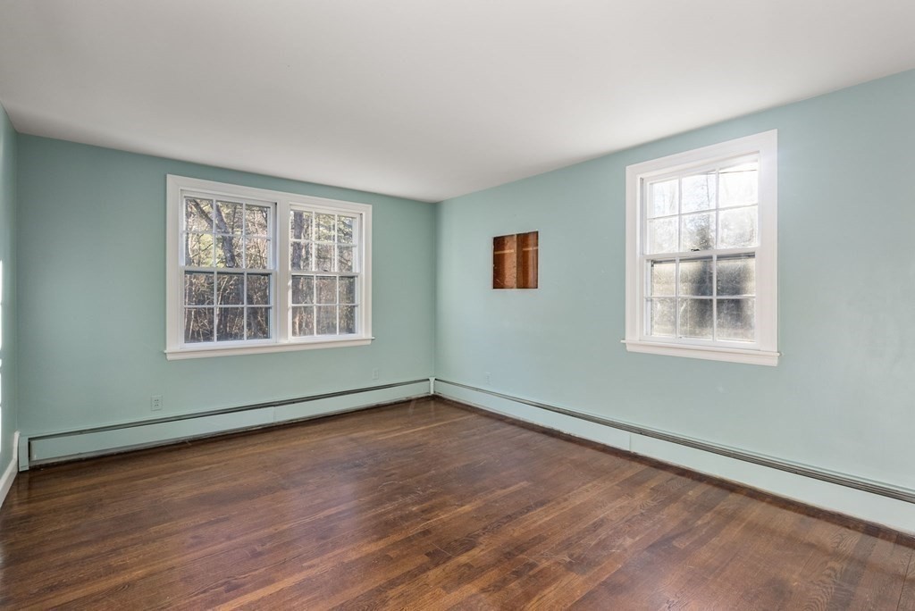 140 Cherry Brook Road Weston, MA 02493 - Photo 31 of 32 a view of an empty room with wooden floor and a window