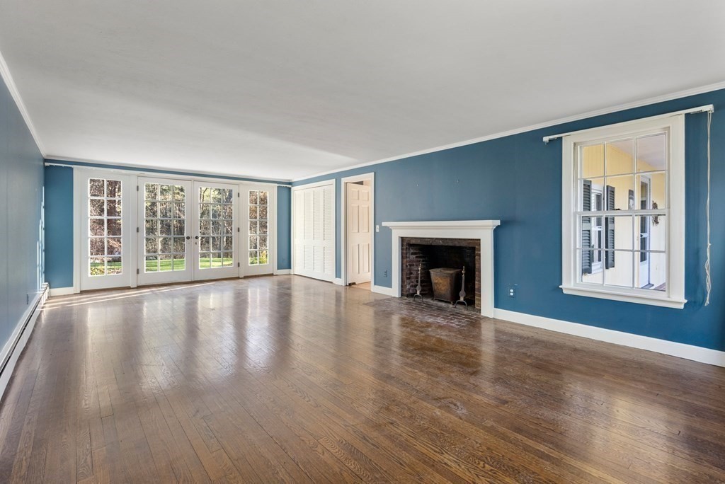 140 Cherry Brook Road Weston, MA 02493 - Photo 5 of 32 a view of an empty room with wooden floor and a window