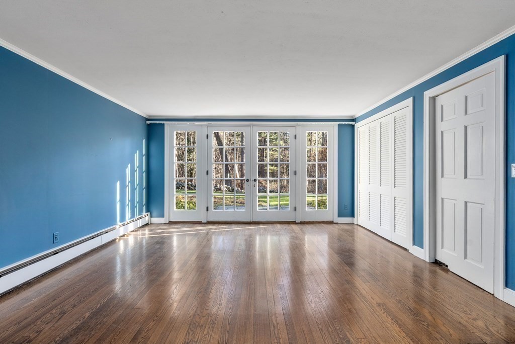 140 Cherry Brook Road Weston, MA 02493 - Photo 6 of 32 a view of an empty room with wooden floor and a window