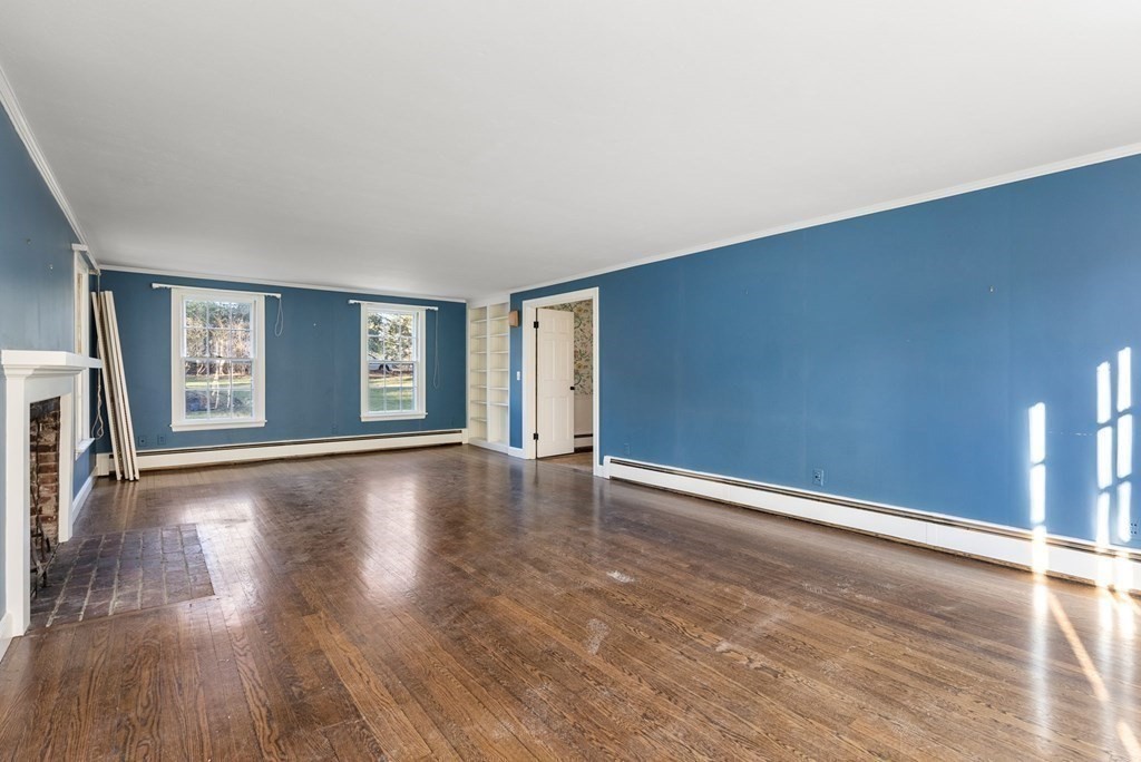 140 Cherry Brook Road Weston, MA 02493 - Photo 7 of 32 a view of an empty room with window and wooden floor