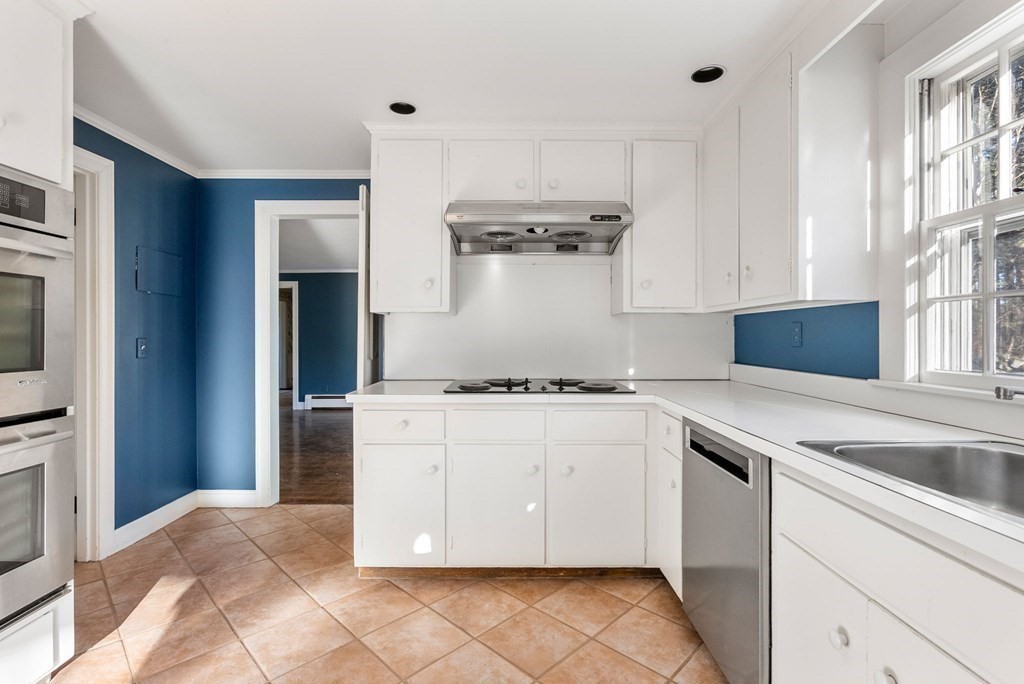 140 Cherry Brook Road Weston, MA 02493 - Photo 8 of 32 a kitchen with a stove and a sink