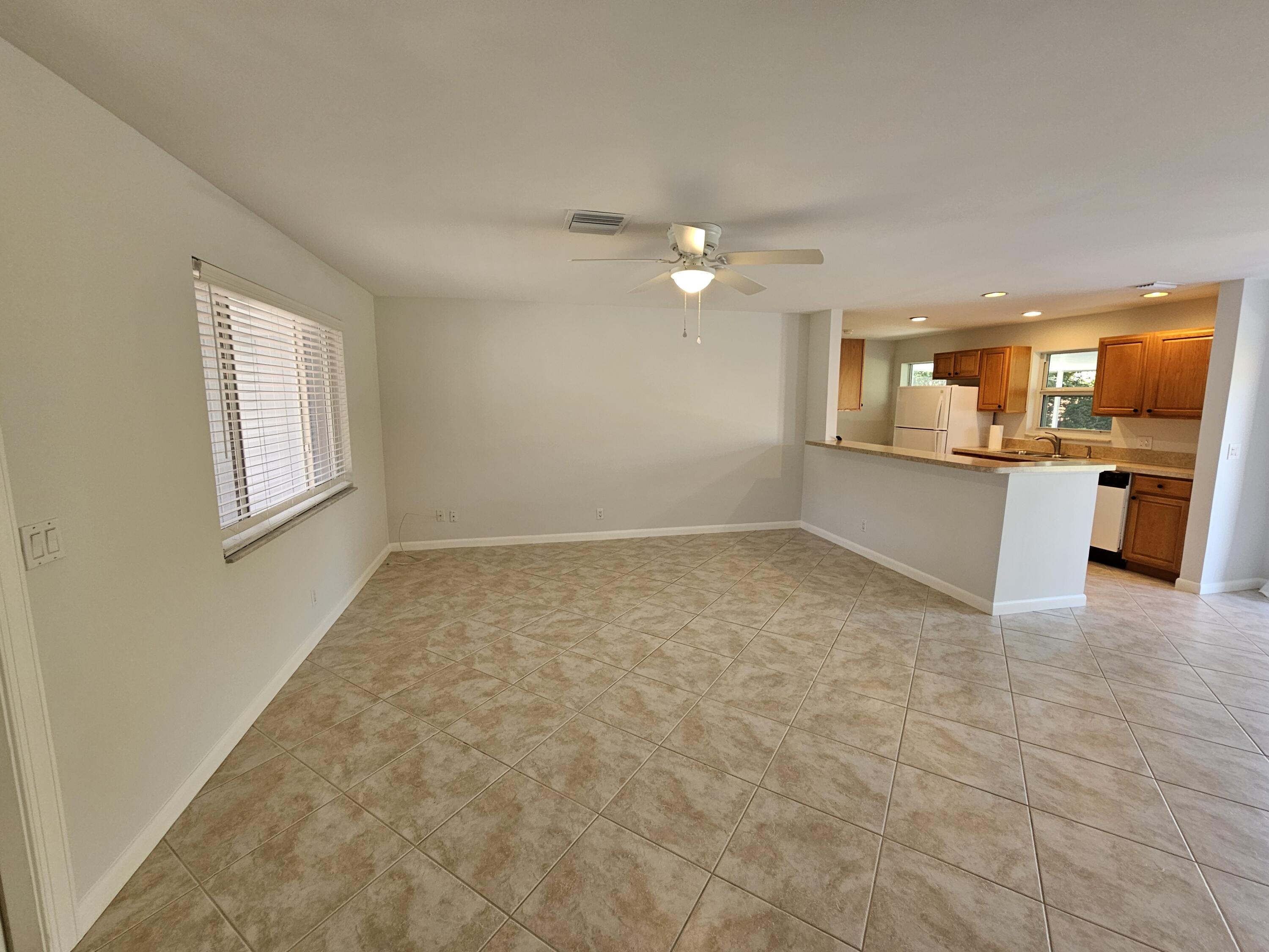 355 Franklin Road Tequesta, FL 33469 - Photo 14 of 33 Living room to kitchen