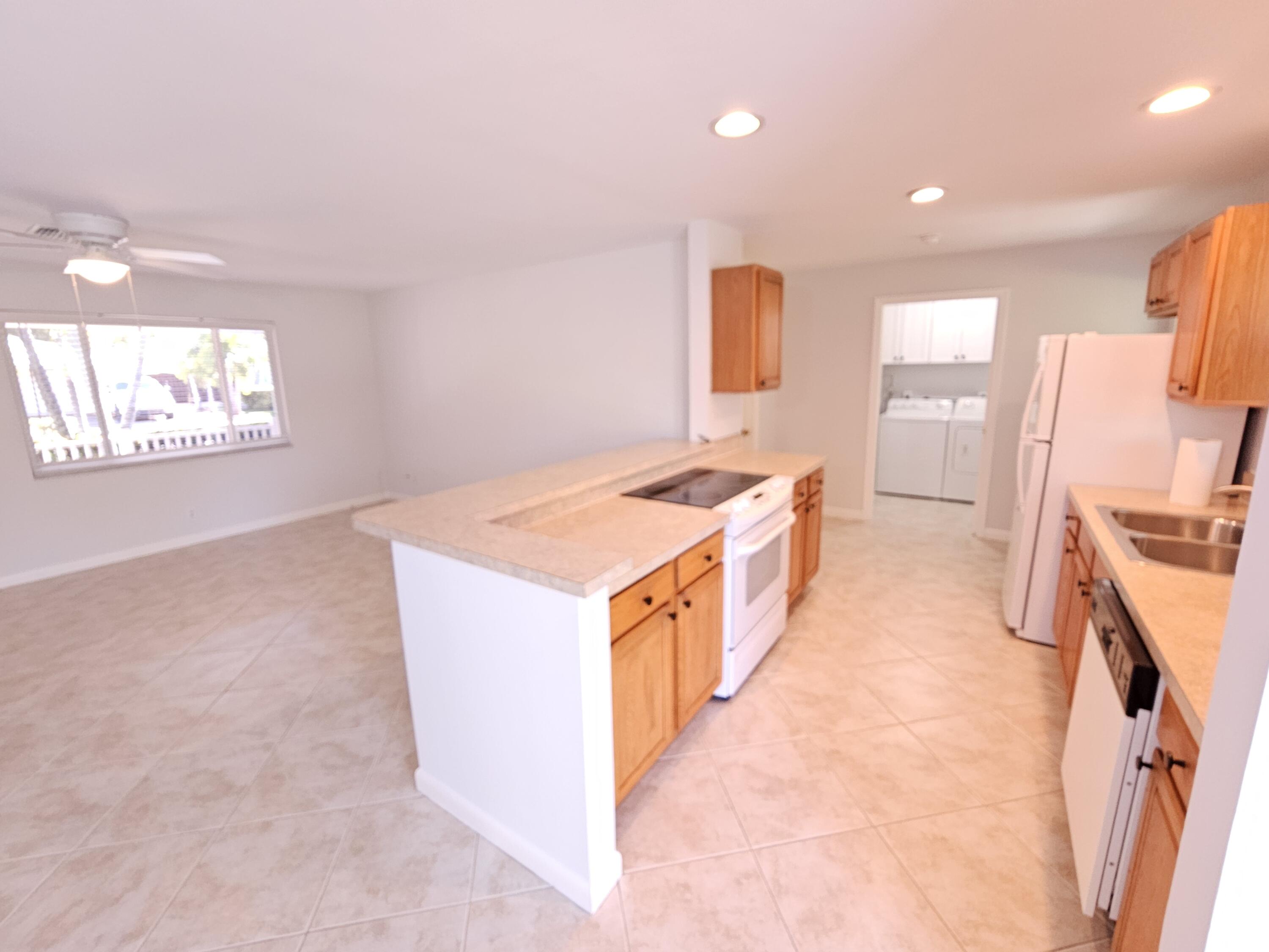 355 Franklin Road Tequesta, FL 33469 - Photo 15 of 33 Kitchen to laundry room