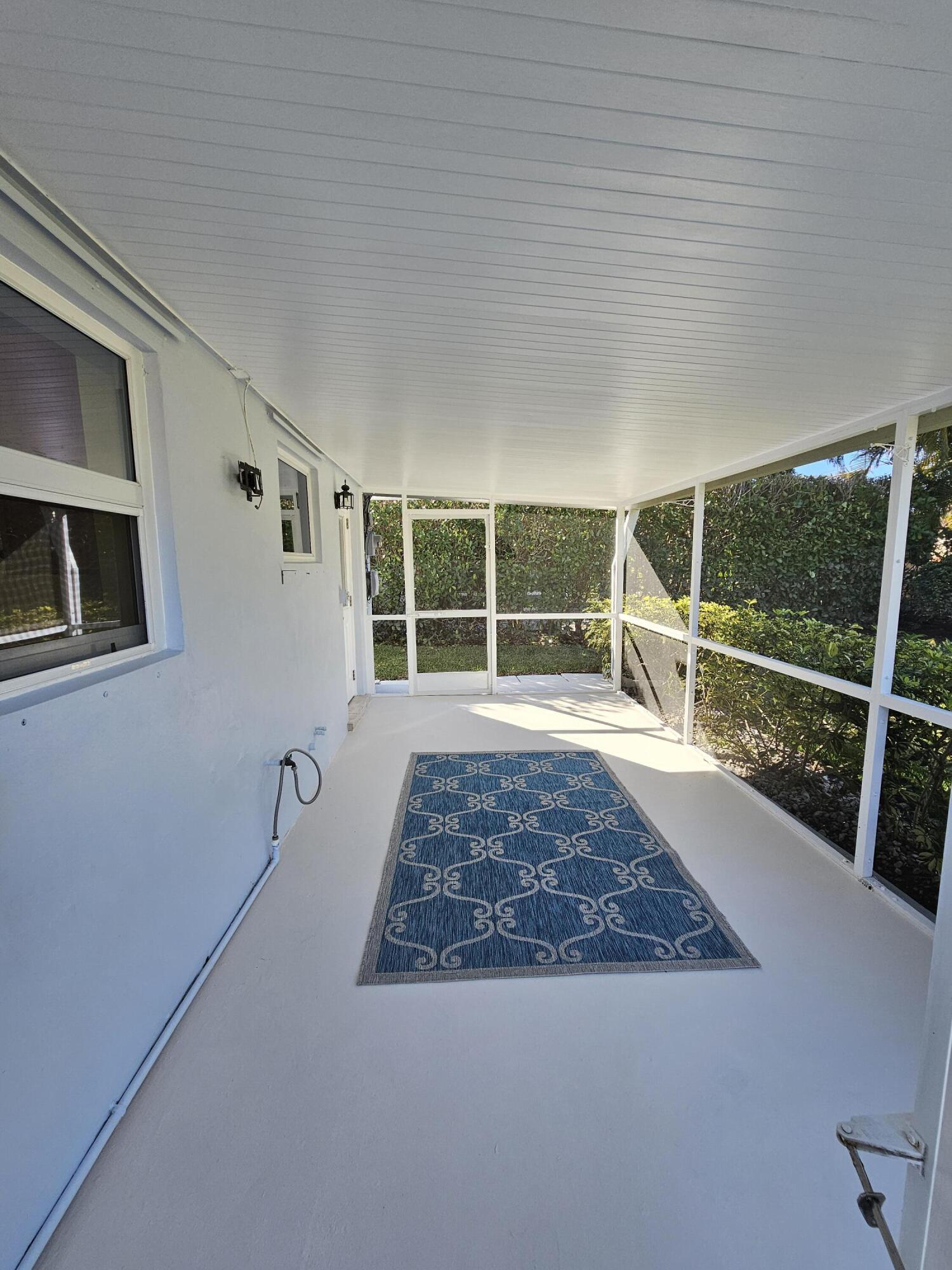 355 Franklin Road Tequesta, FL 33469 - Photo 30 of 33 Rear screened patio