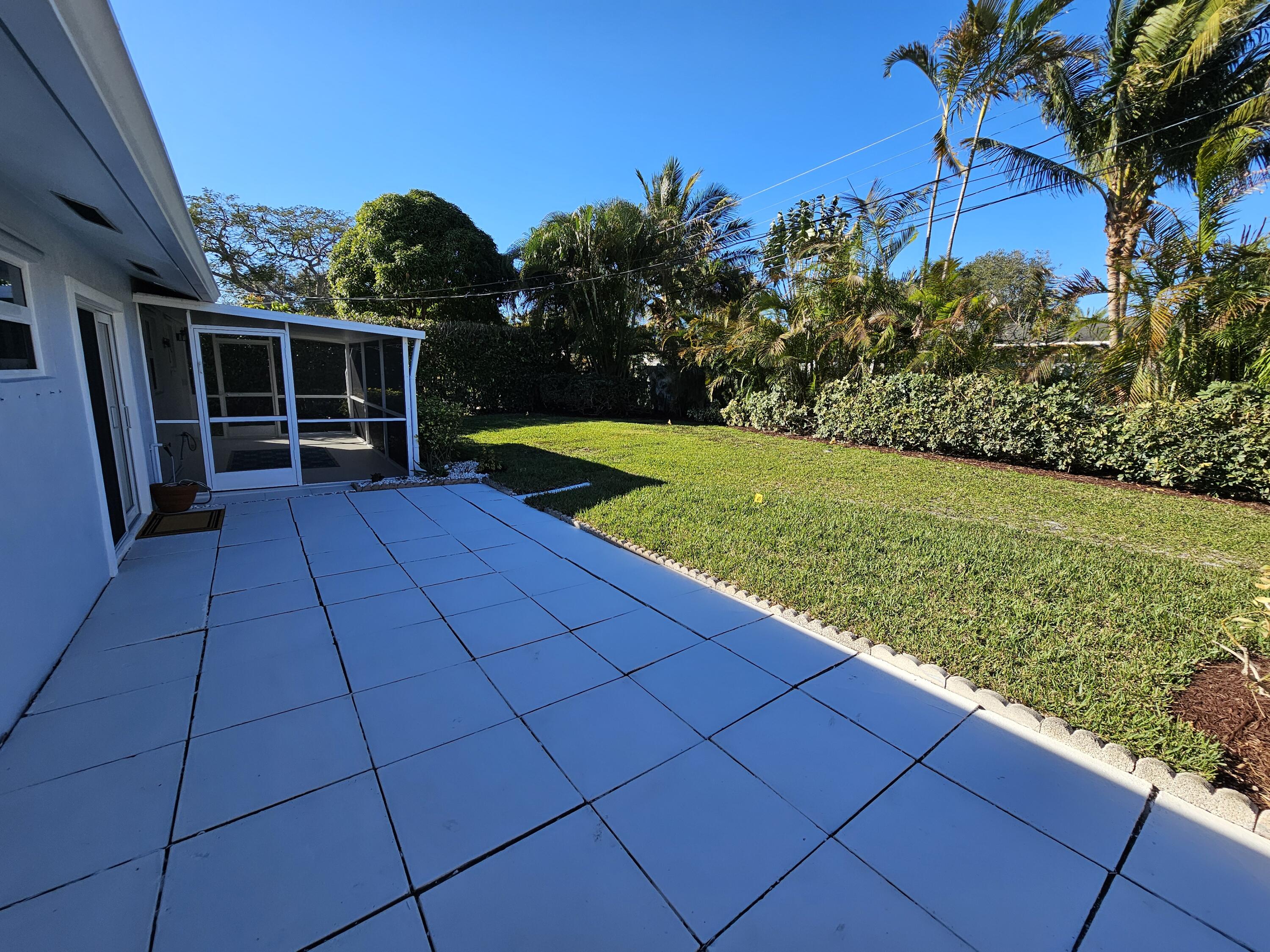 355 Franklin Road Tequesta, FL 33469 - Photo 31 of 33 Large patio, yard and screened porch