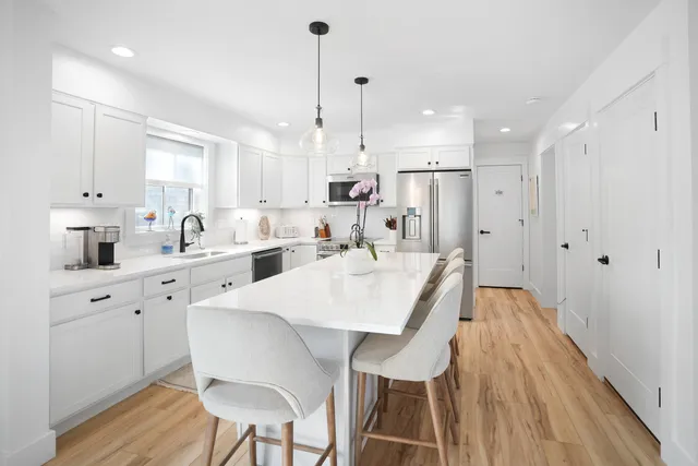 a bedroom with a bed and flat screen tv