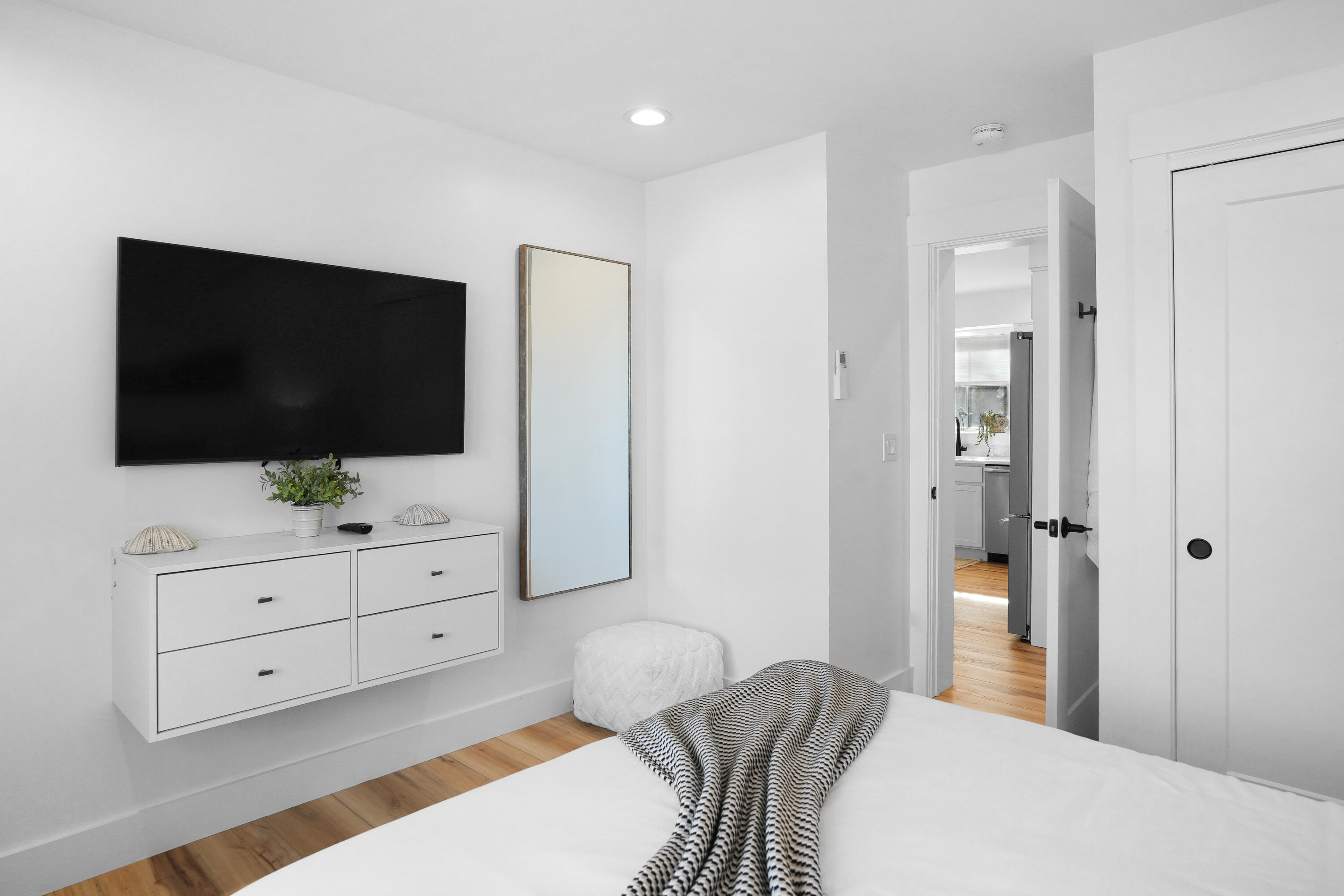 33 Lagoon Pond Road Vineyard Haven, MA 02568 - Photo 19 of 42 a bedroom with a bed and flat screen tv