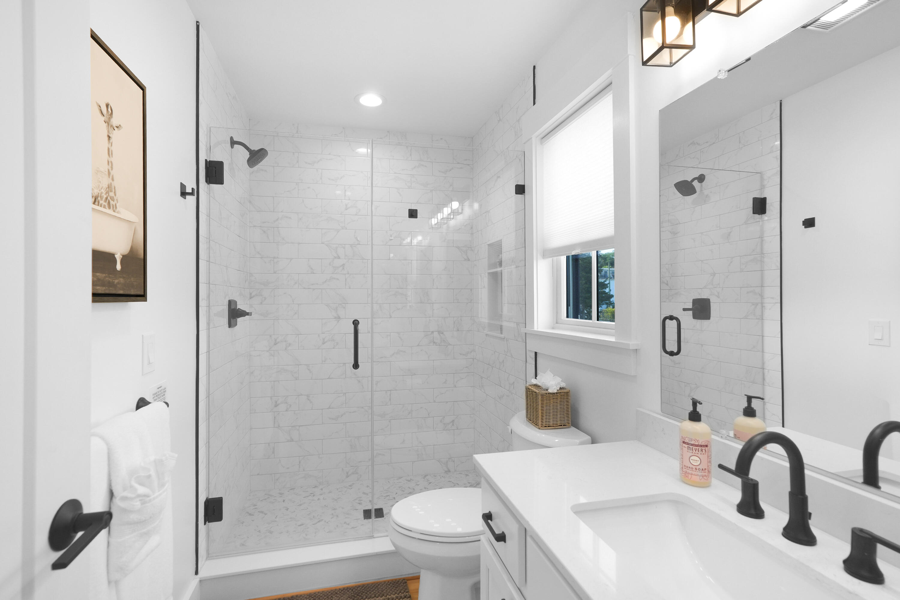 33 Lagoon Pond Road Vineyard Haven, MA 02568 - Photo 20 of 42 a bathroom with a sink toilet and shower