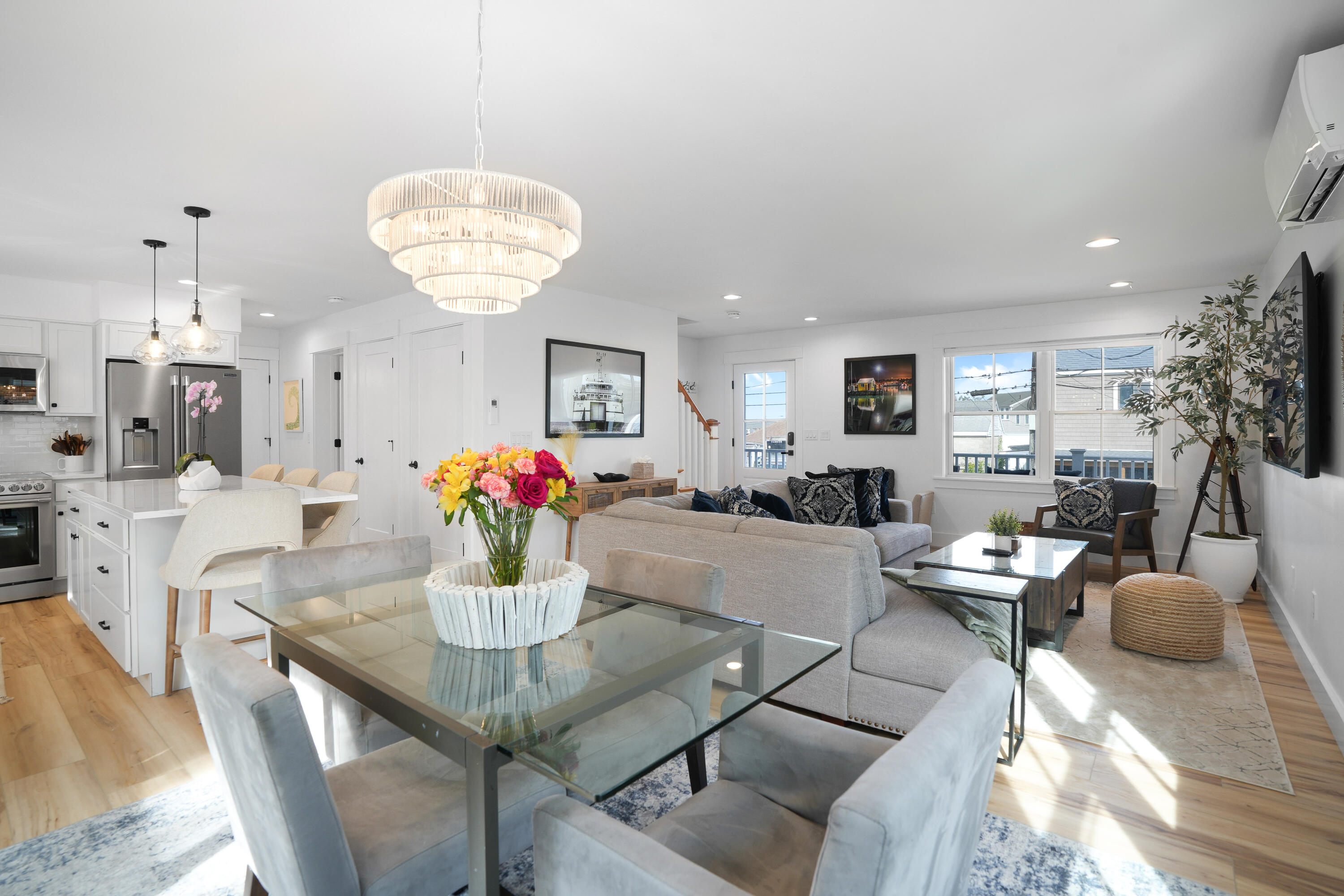 33 Lagoon Pond Road Vineyard Haven, MA 02568 - Photo 21 of 42 a view of a dining room with furniture and chandelier