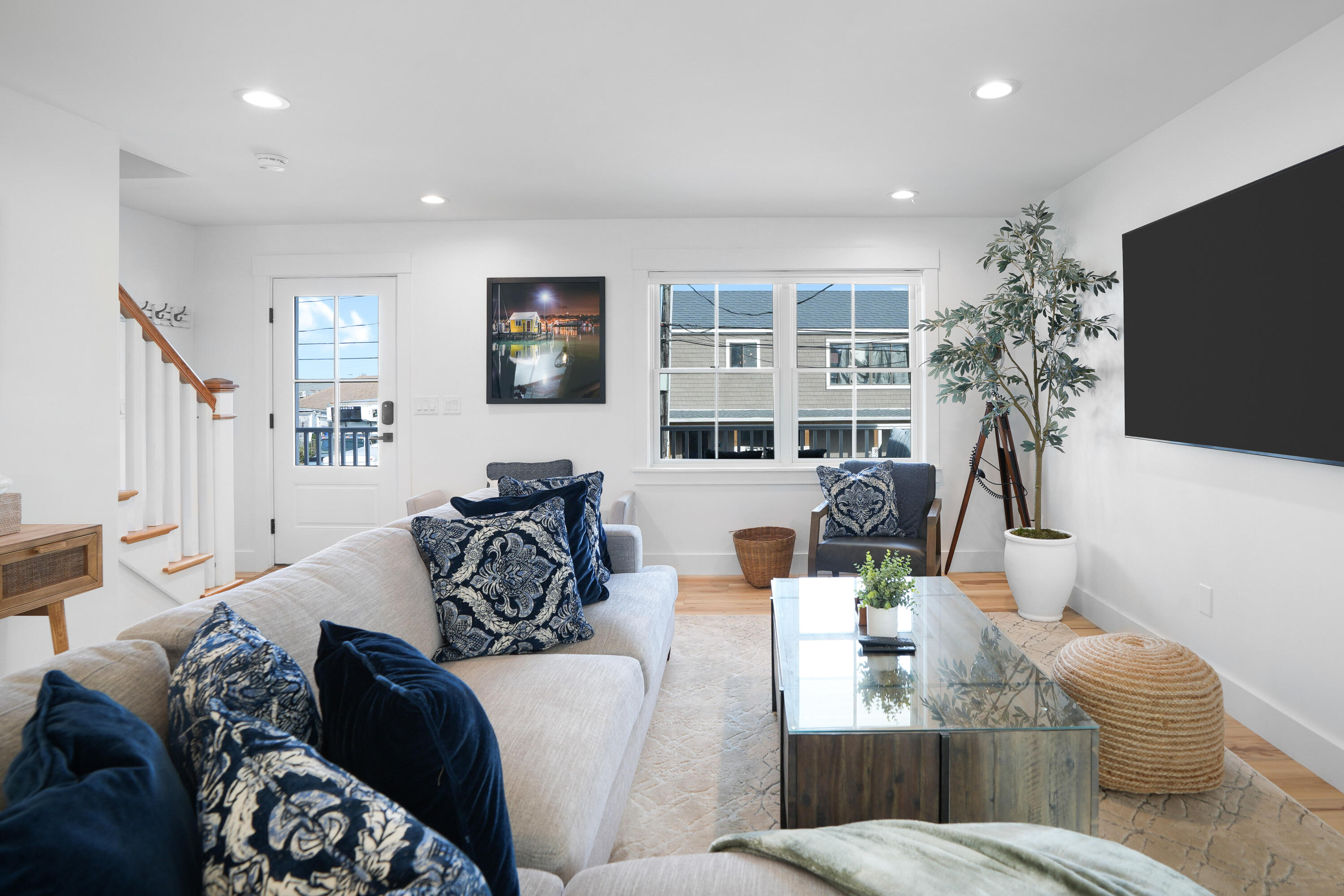 33 Lagoon Pond Road Vineyard Haven, MA 02568 - Photo 22 of 42 a living room with furniture a flat screen tv and a large window