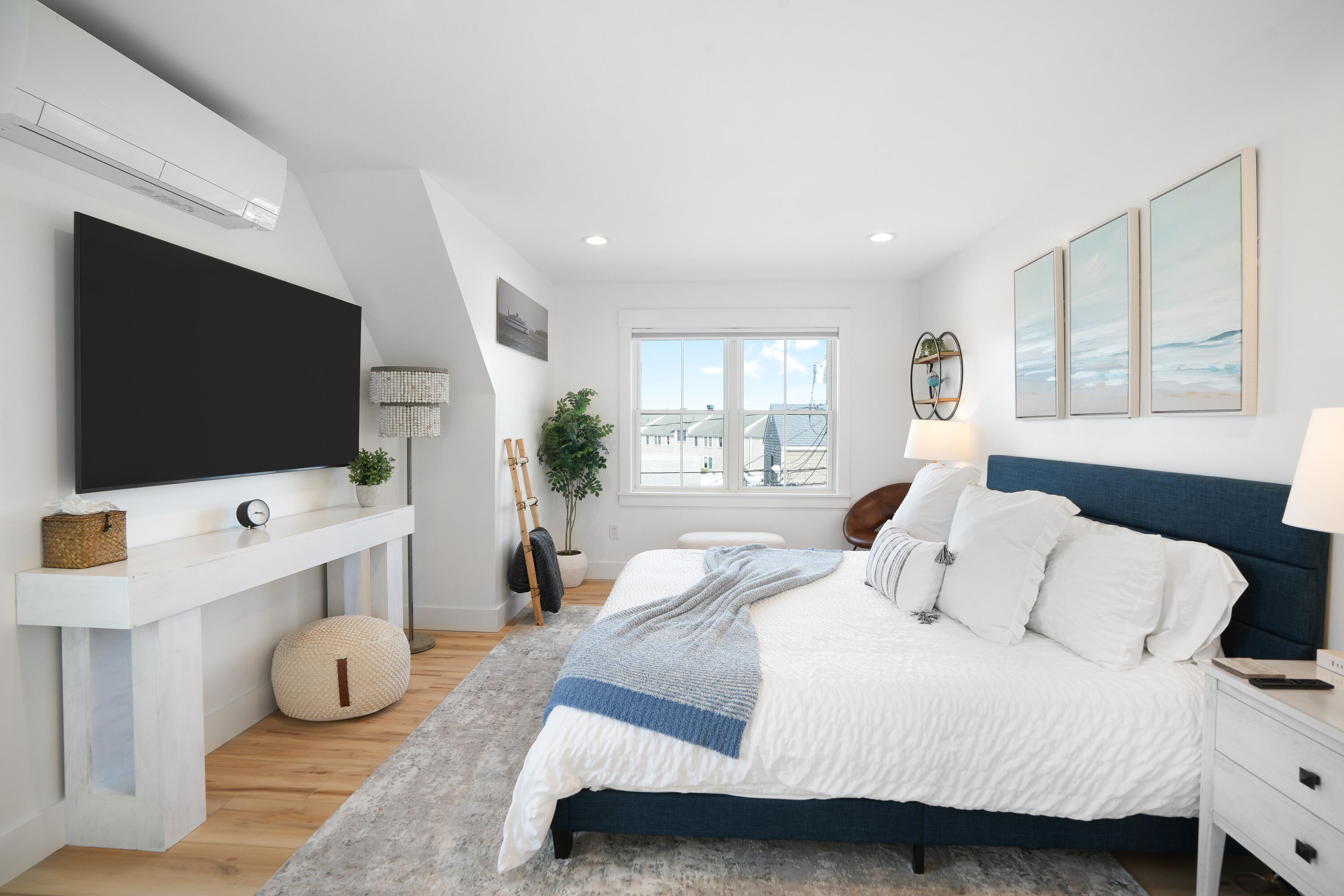 33 Lagoon Pond Road Vineyard Haven, MA 02568 - Photo 24 of 42 a bedroom with a bed and a flat screen tv