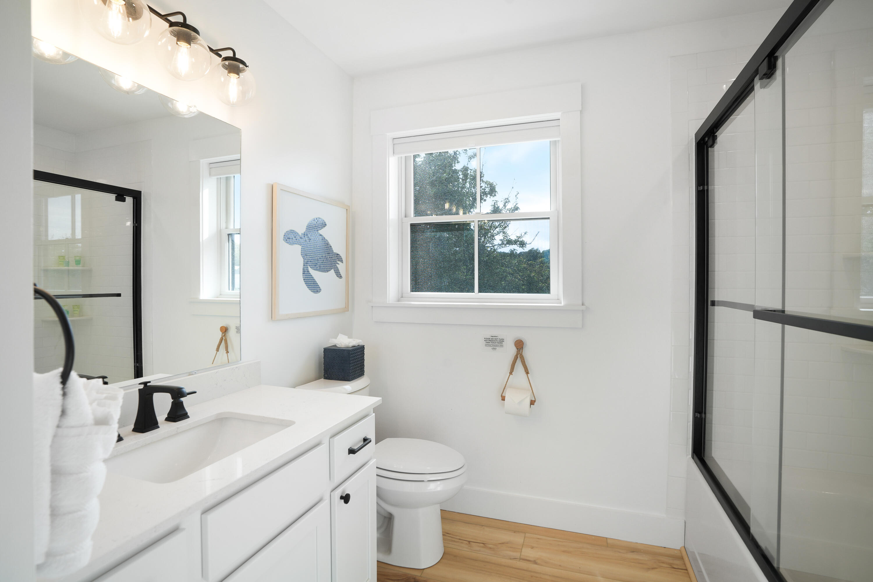 33 Lagoon Pond Road Vineyard Haven, MA 02568 - Photo 26 of 42 a bathroom with a sink toilet and mirror