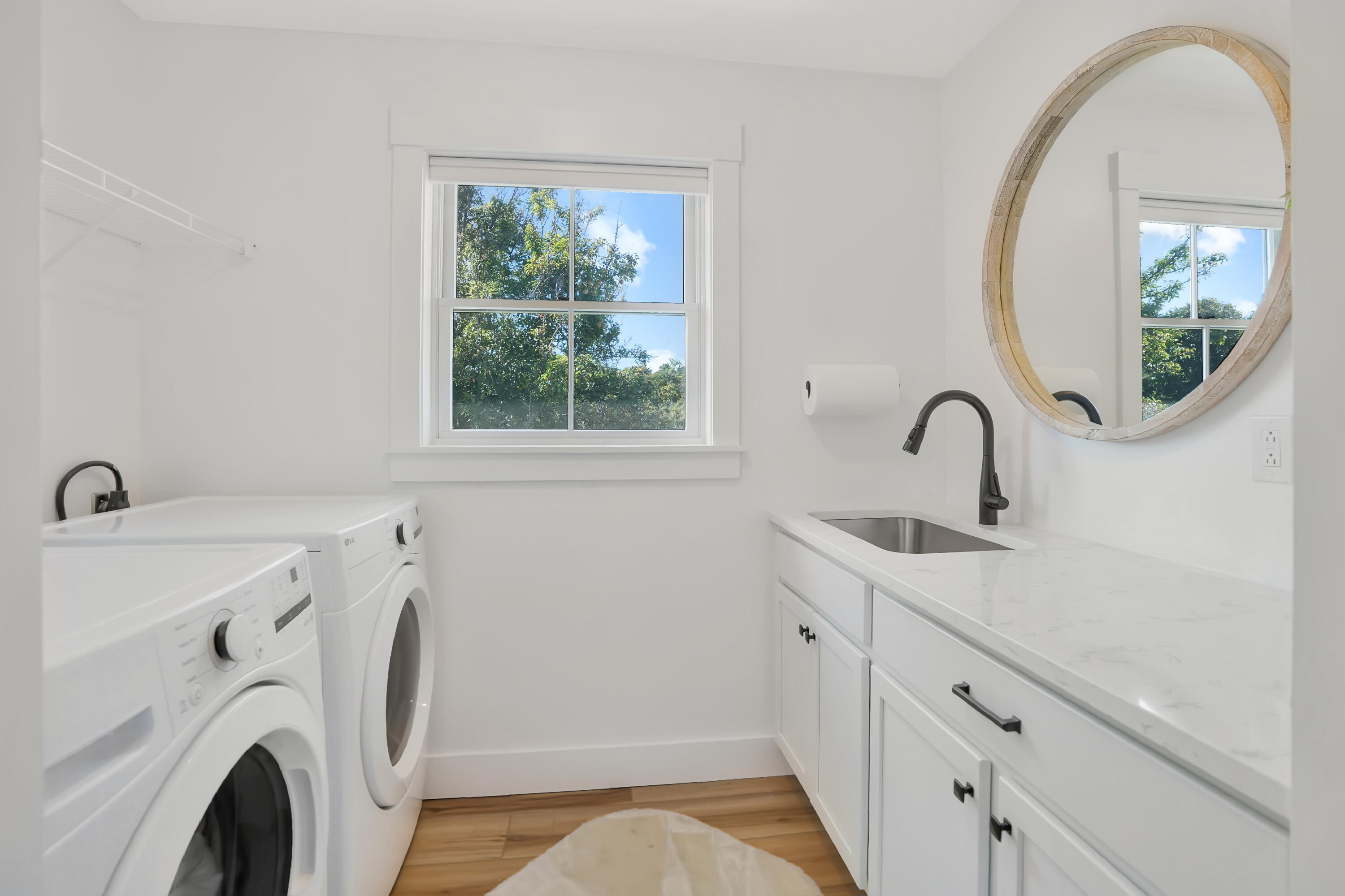 33 Lagoon Pond Road Vineyard Haven, MA 02568 - Photo 29 of 42 a bathroom with a sink and a mirror