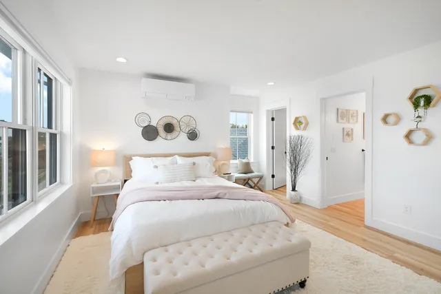 a bedroom with a bed and window