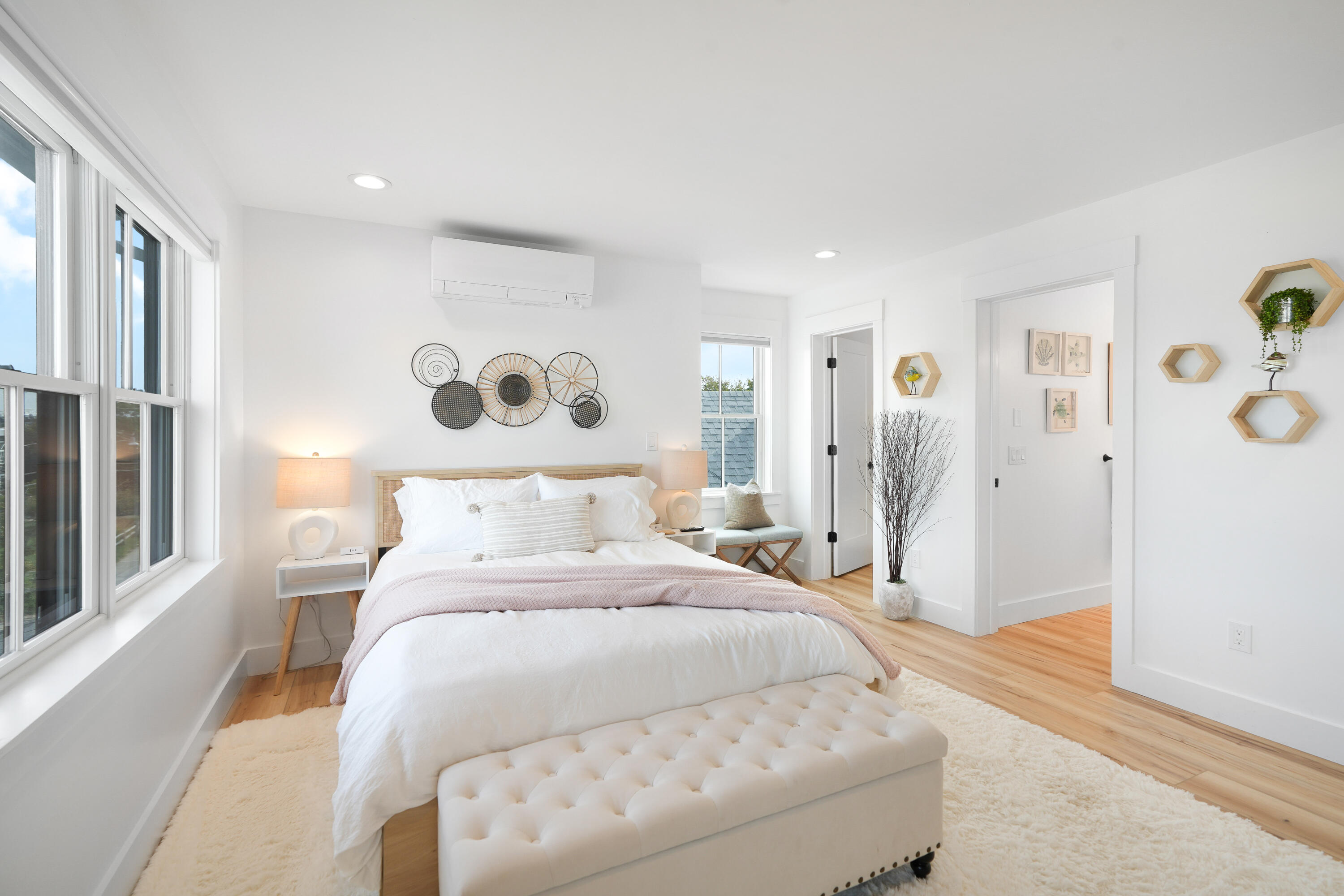 33 Lagoon Pond Road Vineyard Haven, MA 02568 - Photo 32 of 42 a spacious bedroom with a bed and a window