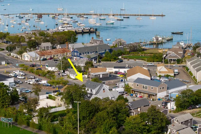 an aerial view of houses with yard
