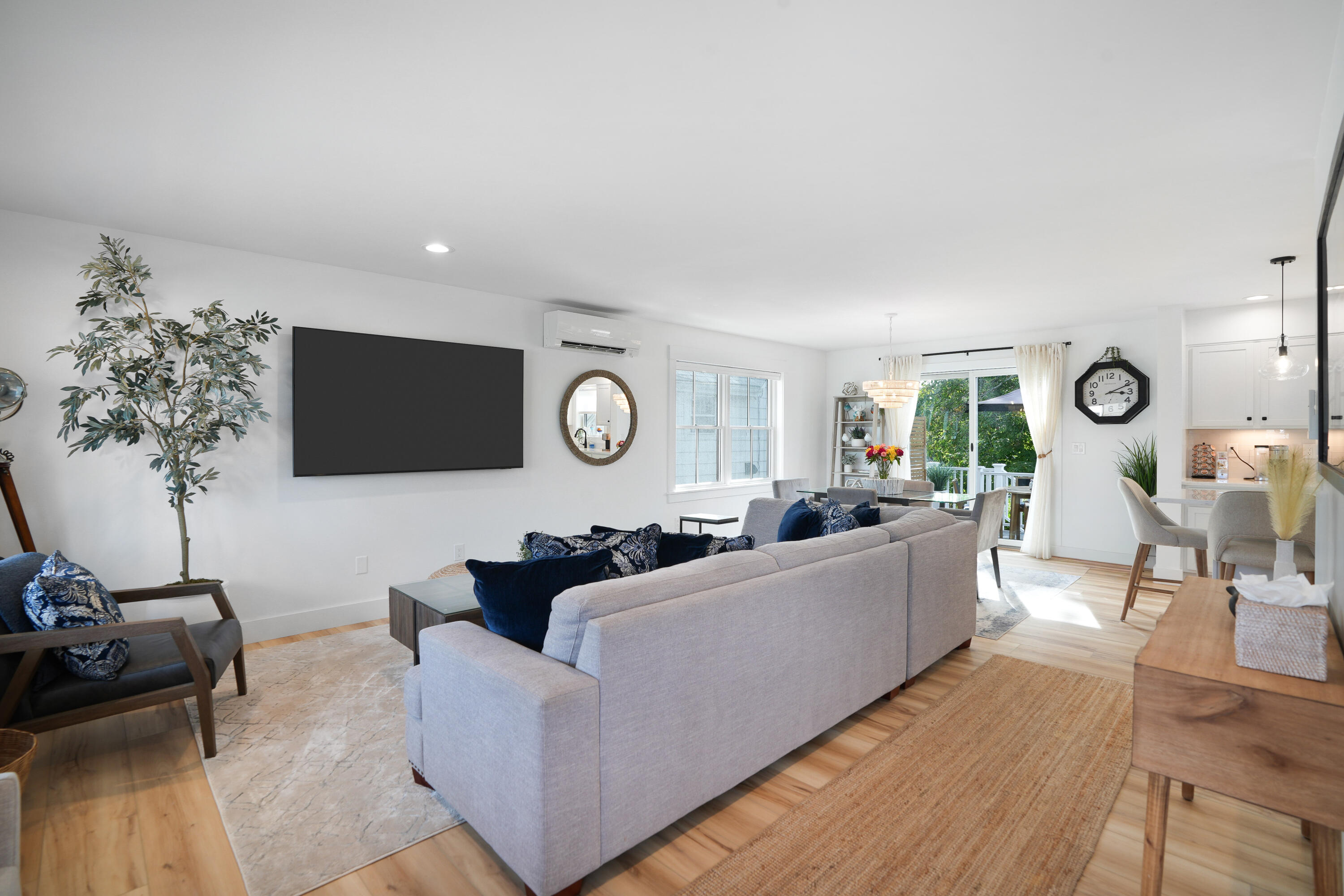 33 Lagoon Pond Road Vineyard Haven, MA 02568 - Photo 7 of 42 a living room with furniture and a flat screen tv