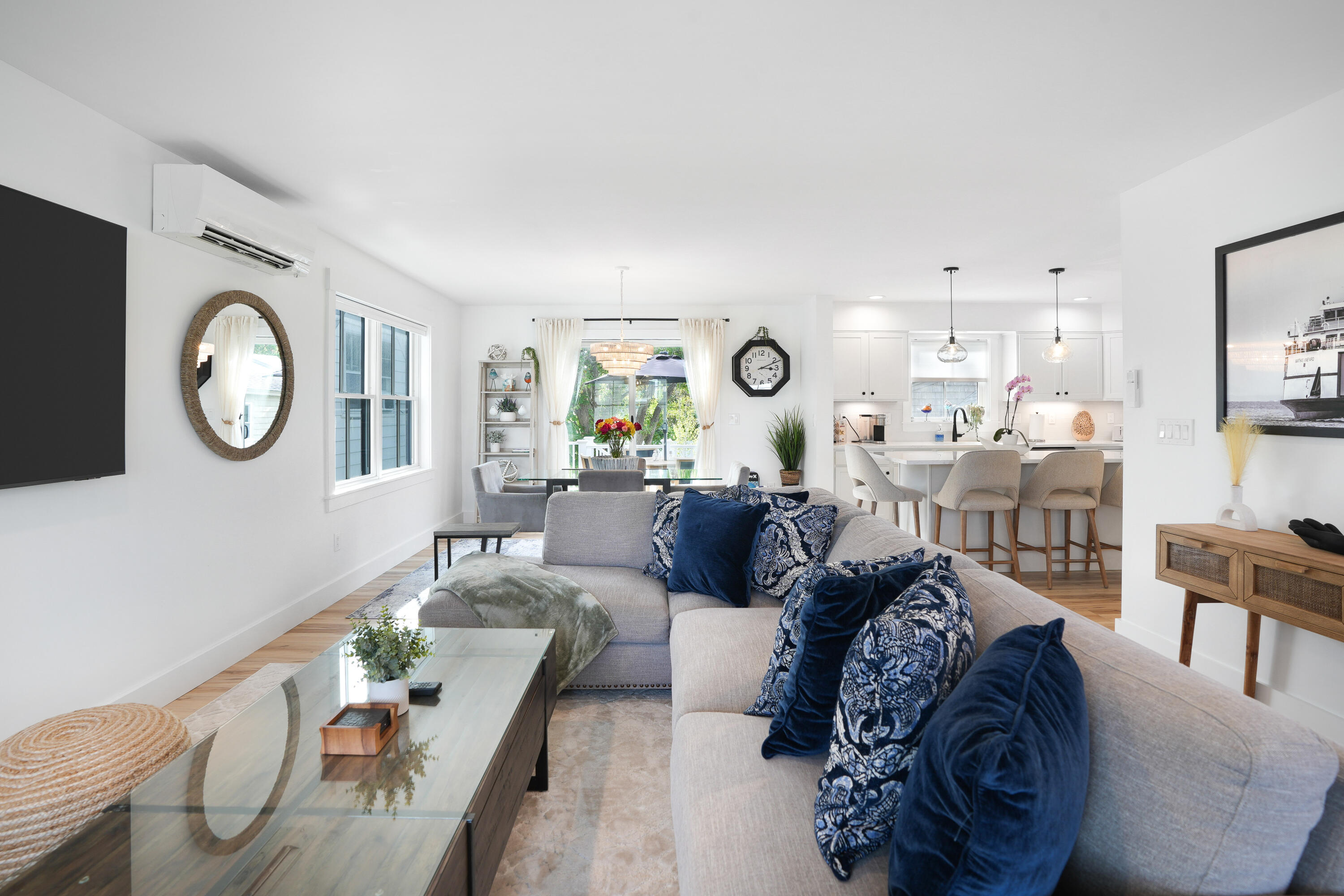33 Lagoon Pond Road Vineyard Haven, MA 02568 - Photo 9 of 42 a living room with furniture and a mirror