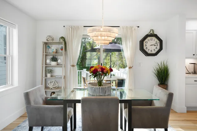 a view of a patio with table and chairs under an umbrella