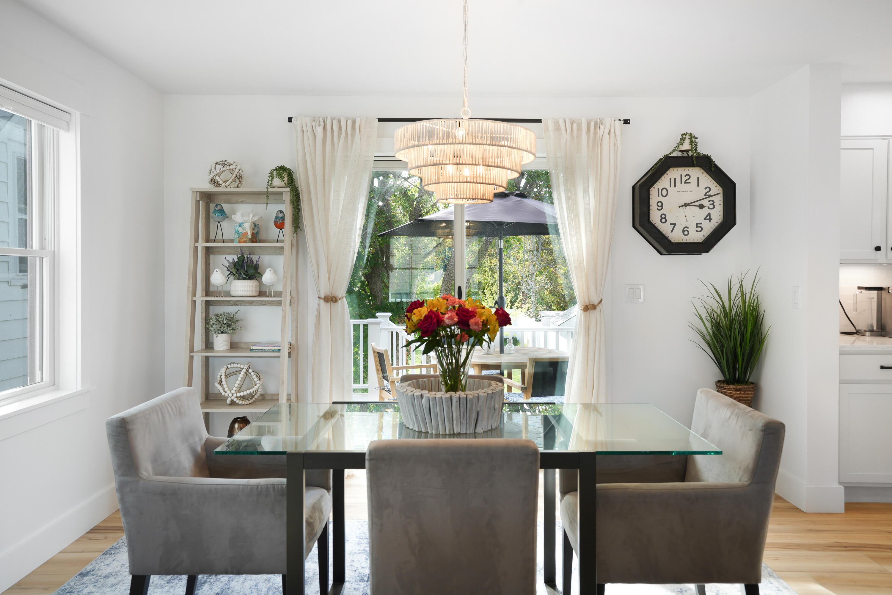 33 Lagoon Pond Road Vineyard Haven, MA 02568 - Photo 10 of 42 a dining room with furniture a potted plant and a large window